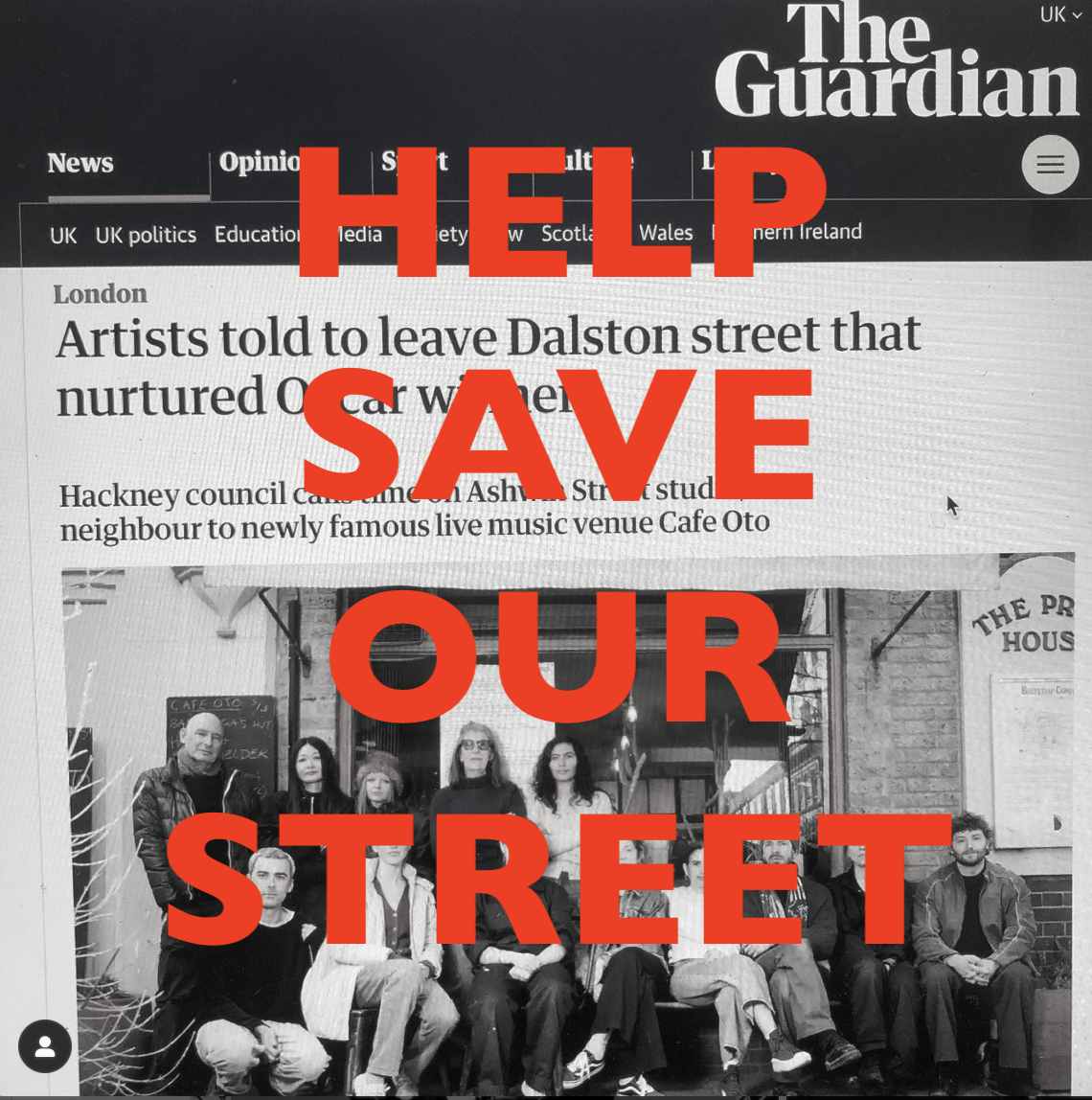 A black and white photograph of a group of people standing and sitting in front of a building, with a large red overlay text that reads, 'HELP SAVE OUR STREET,' covering the photo. The background shows part of a sign saying 'THE PR... HOUSE.'