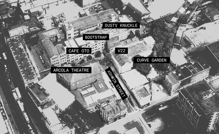Aerial view of an urban area with labels indicating landmarks and streets, including Dusty Knuckle, Bootstrap, Cafe Oto, Arcola Theatre, V22, Curve Garden, and Ashwin Street.