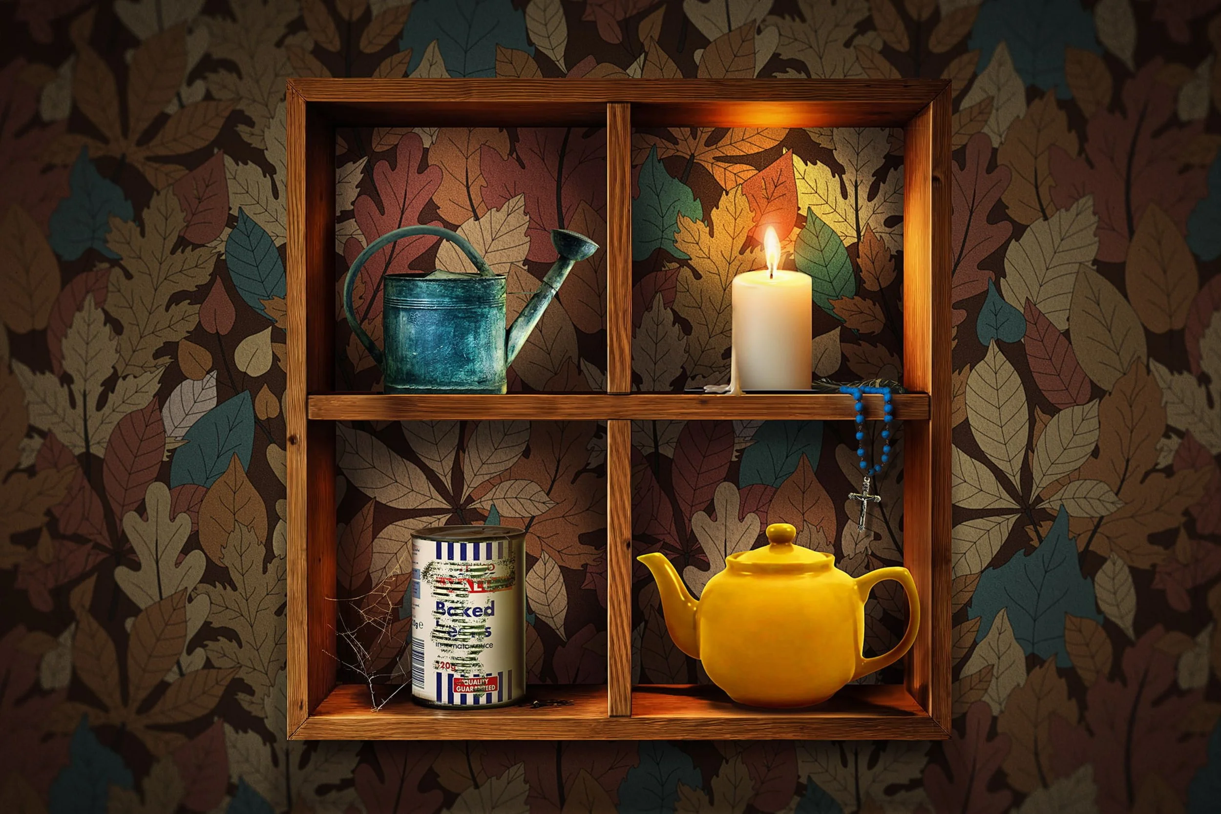 Wooden shelf with three compartments against a leaf-patterned wallpaper. Top left contains a green watering can; top right has a lit white candle and blue beads. Bottom left features a can of paint; bottom right has a yellow teapot.