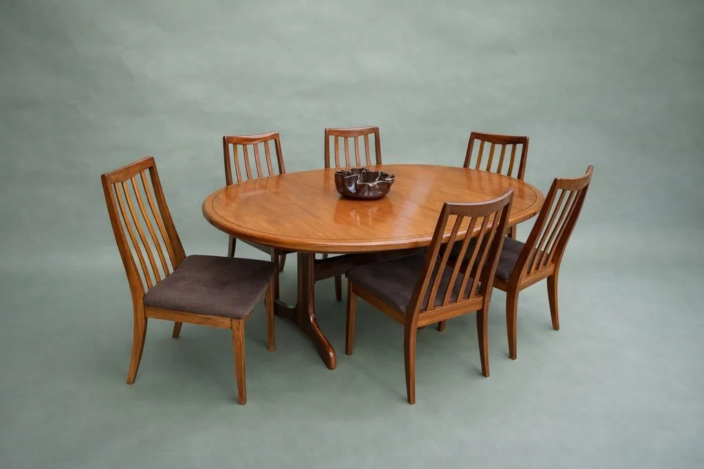 SOLD

G-Plan Teak Extending Dining Table and Six Chairs, Great Britain, circa 1960s.

Oval teak top with a self-storing center leaf and a dark inlay line running the perimeter &mdash; a less common detail on this table line. Sled/trestle base. The si