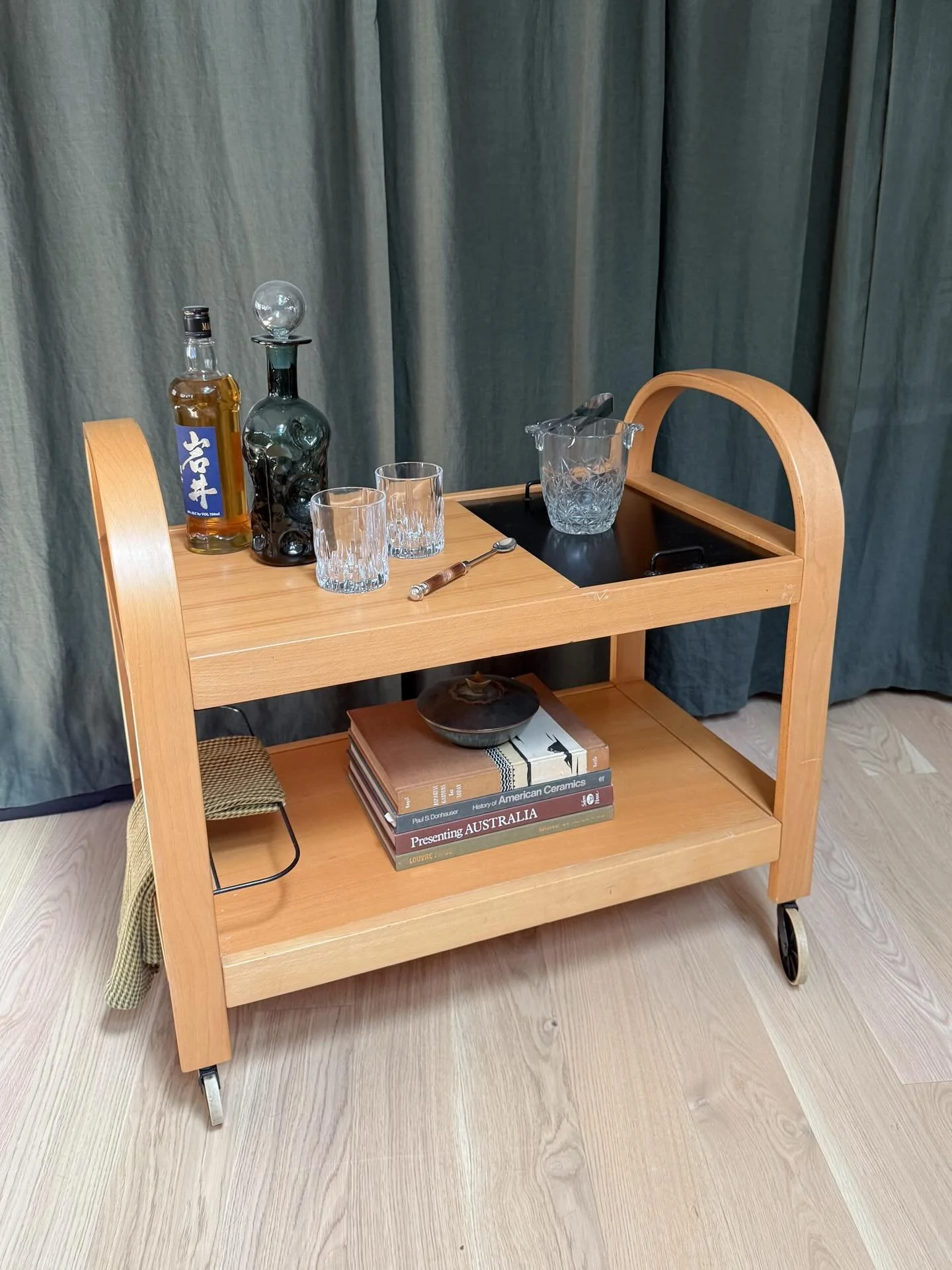 *AVAILABLE* &mdash; $250

Scandinavian Beech Bar Cart with Bentwood Arch Handles, circa 1970s&ndash;1980s

Two-tier beech cart with a pair of arched bentwood handles and four swivel casters. The upper shelf has two removable inserts &mdash; each reve