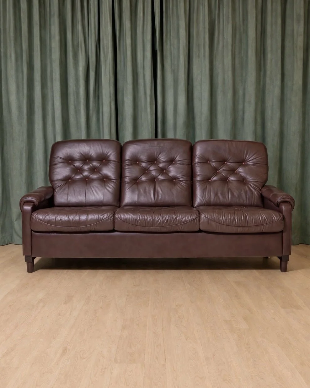 *AVAILABLE* $1,600

Vintage 1970s Danish Modern 3-Seater Leather and Rosewood Sofa (Matching Armchairs Available)

Pristine vintage condition! Rich, dark chocolate tufted leather Danish Modern 3-seater sofa on rosewood base, circa 1970s. The &ldquo;s
