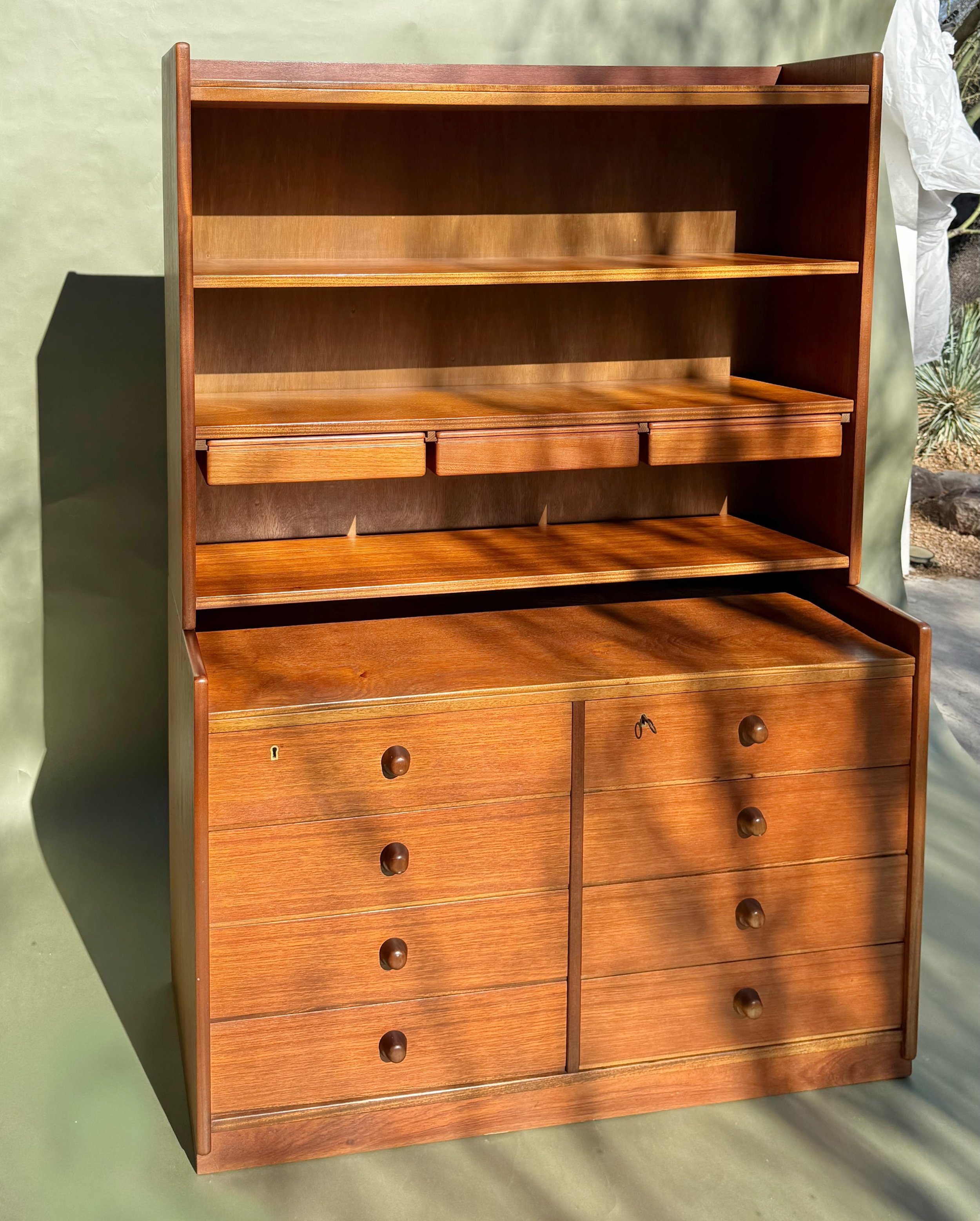 *AVAILABLE* &mdash; $1450

BDM (Brande, Denmark) Teak Chest with Bookcase Hutch - circa 1960s

Two-piece Danish teak unit from BDM of Brande, Denmark. The lower chest runs eight drawers split across two columns, with turned teak knobs and a brass loc