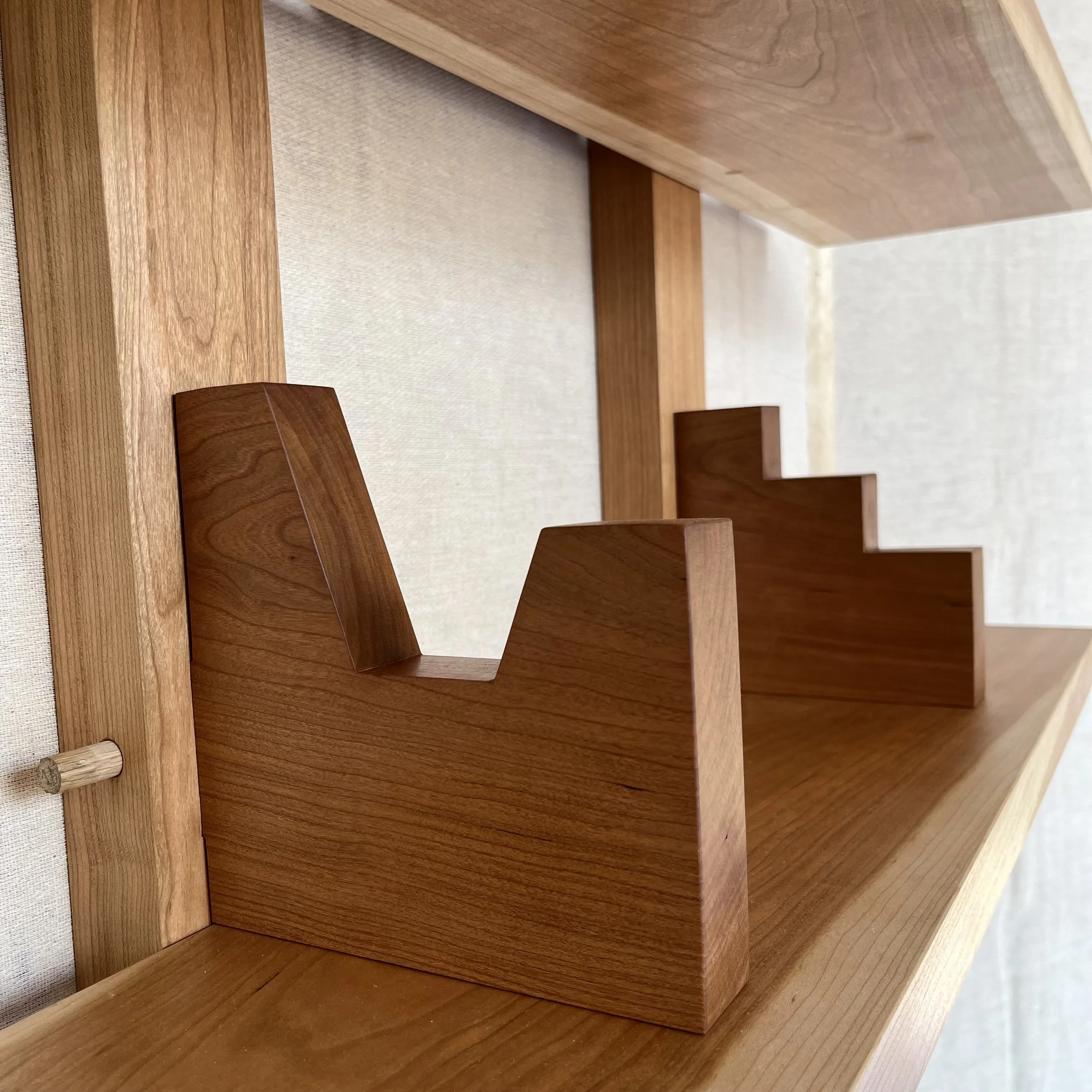 ...every shelf's holder is a silhouette of a "little" building...
