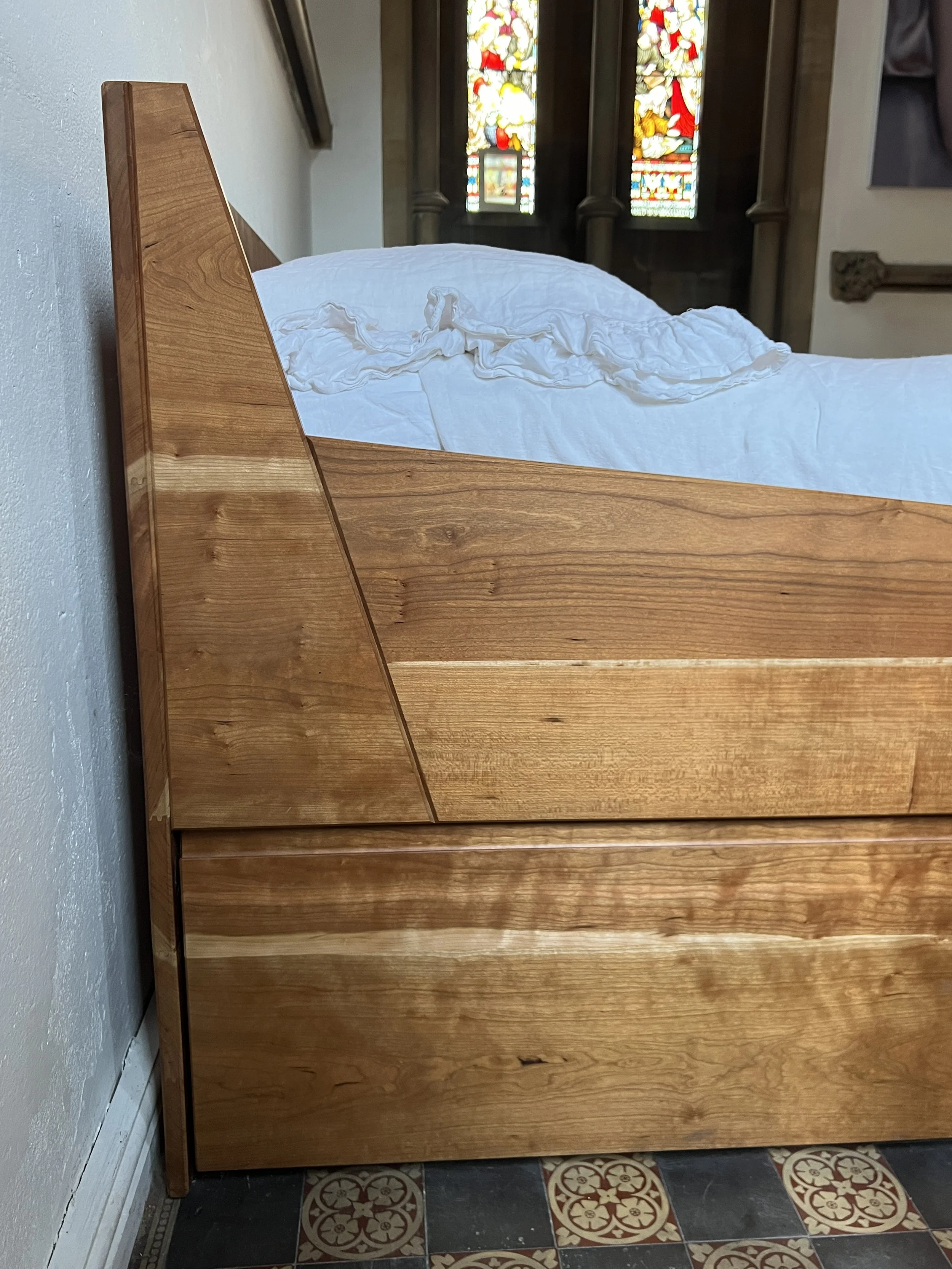 ...made in solid cherry for a unique bedroom.