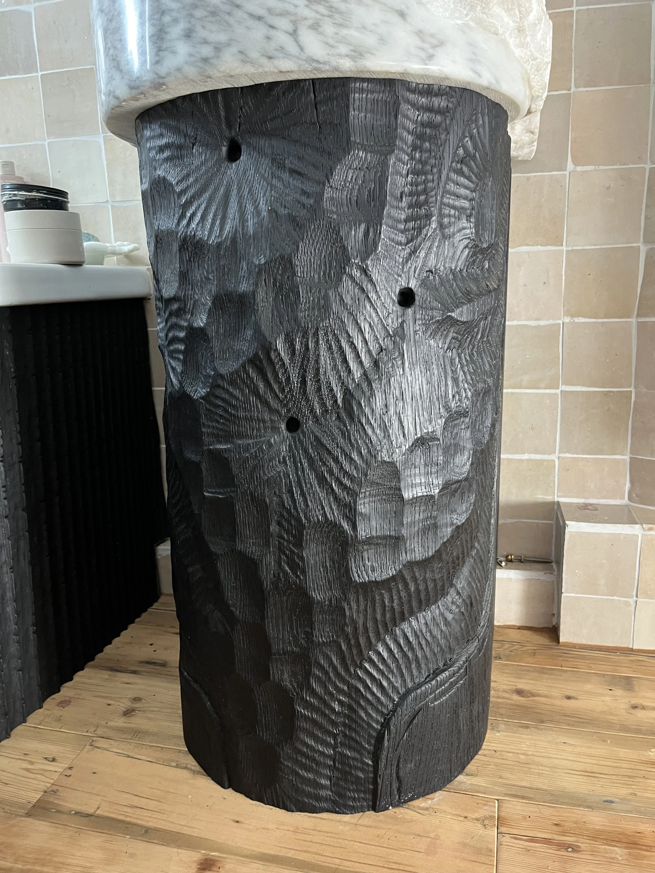 ....with a hand-sculptured sink base...