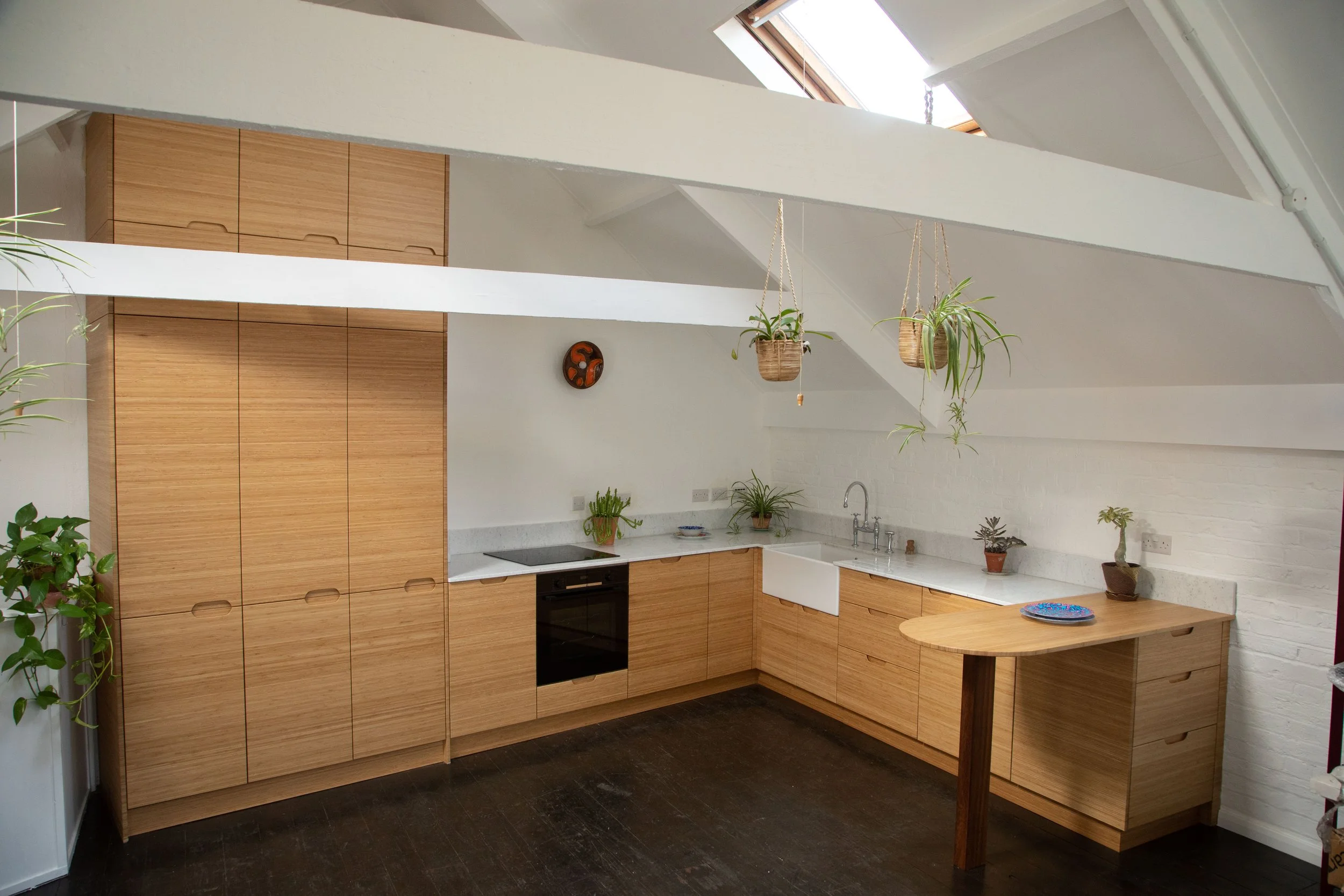 Kitchen for a very busy artist's studio: bamboo combined with an Italian marble top...