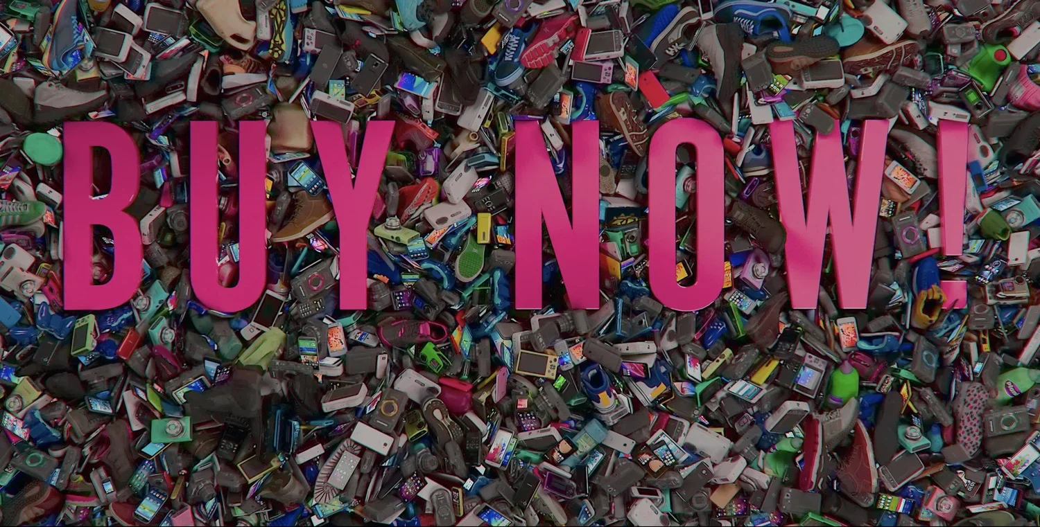 A large pile of various old mobile phones with the words 'BUY NOW!' written in big pink letters across the center. Poster for the documentary Buy Now! The Shopping Conspiracy.