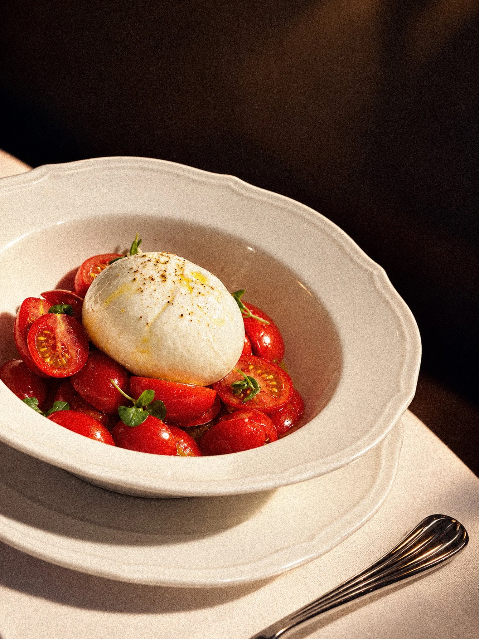 Burrata and Tomatoes in Warm Light.jpg