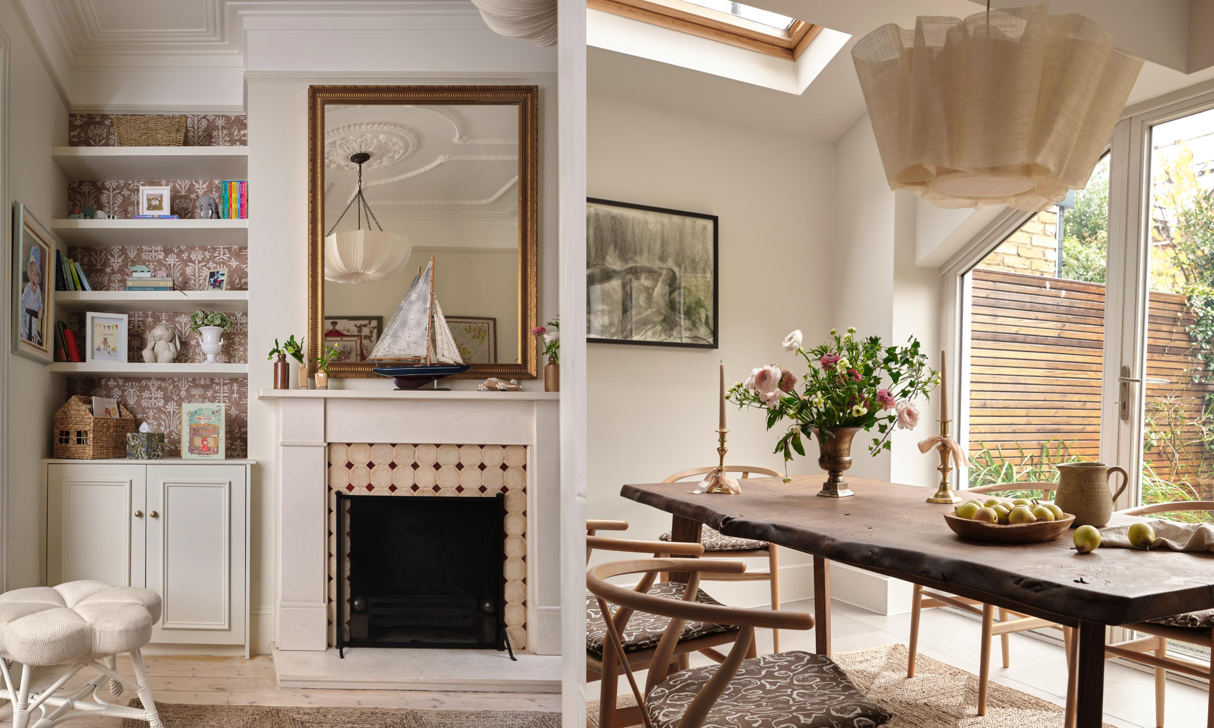 Interior of a bright, modern living and dining room with a fireplace, large mirror, built-in shelves, wooden dining table, vase of flowers, candles, and large windows with a view of the garden.