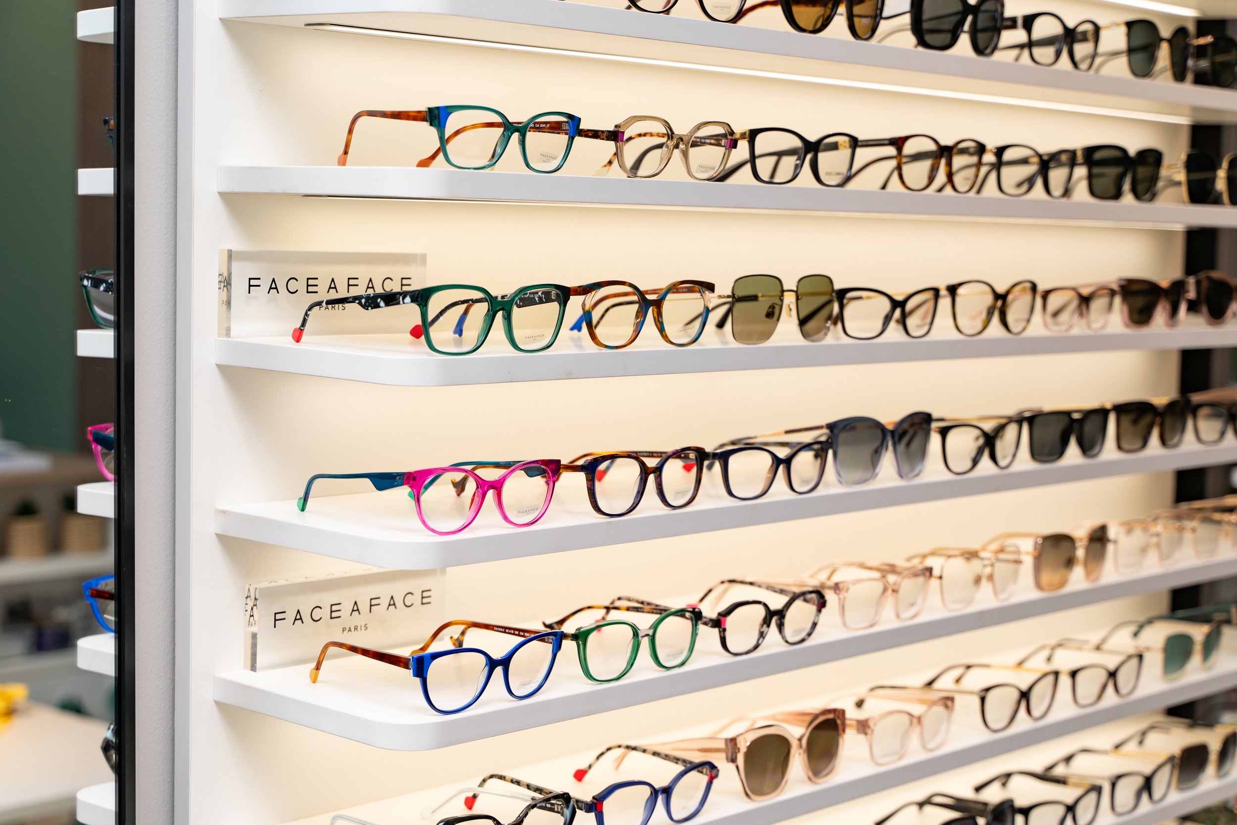 frame display with boutique frames face a face