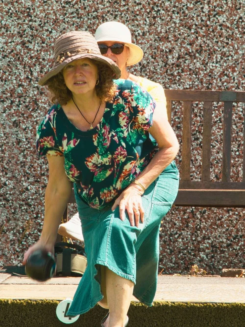 Woman playing bowls in bowls taster session Lowdham
