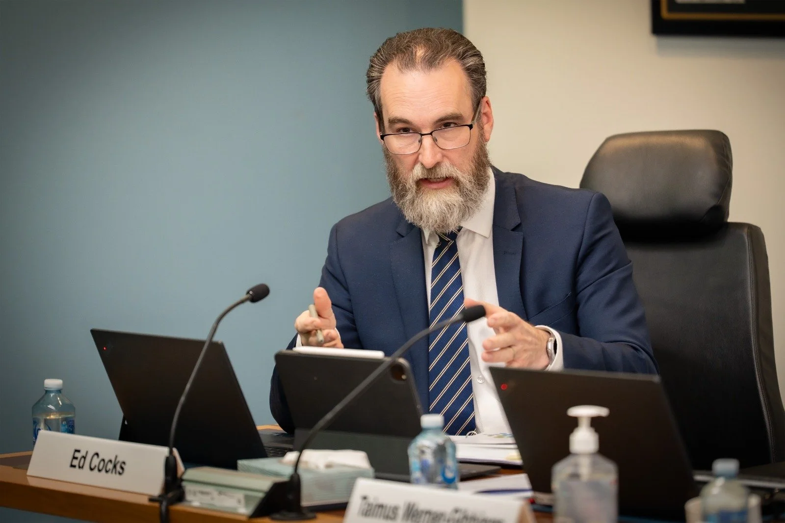 Ed Cocks questioning the Government at a committee hearing