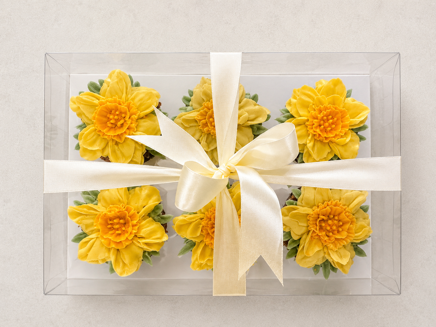 Hand-piped yellow daffodil cupcakes arranged as a floral tribute bouquet, handcrafted in Dublin by Full Bloom Bakehouse. Thoughtfully designed buttercream flowers suitable for remembrance gifts, sympathy gestures and meaningful occasions.