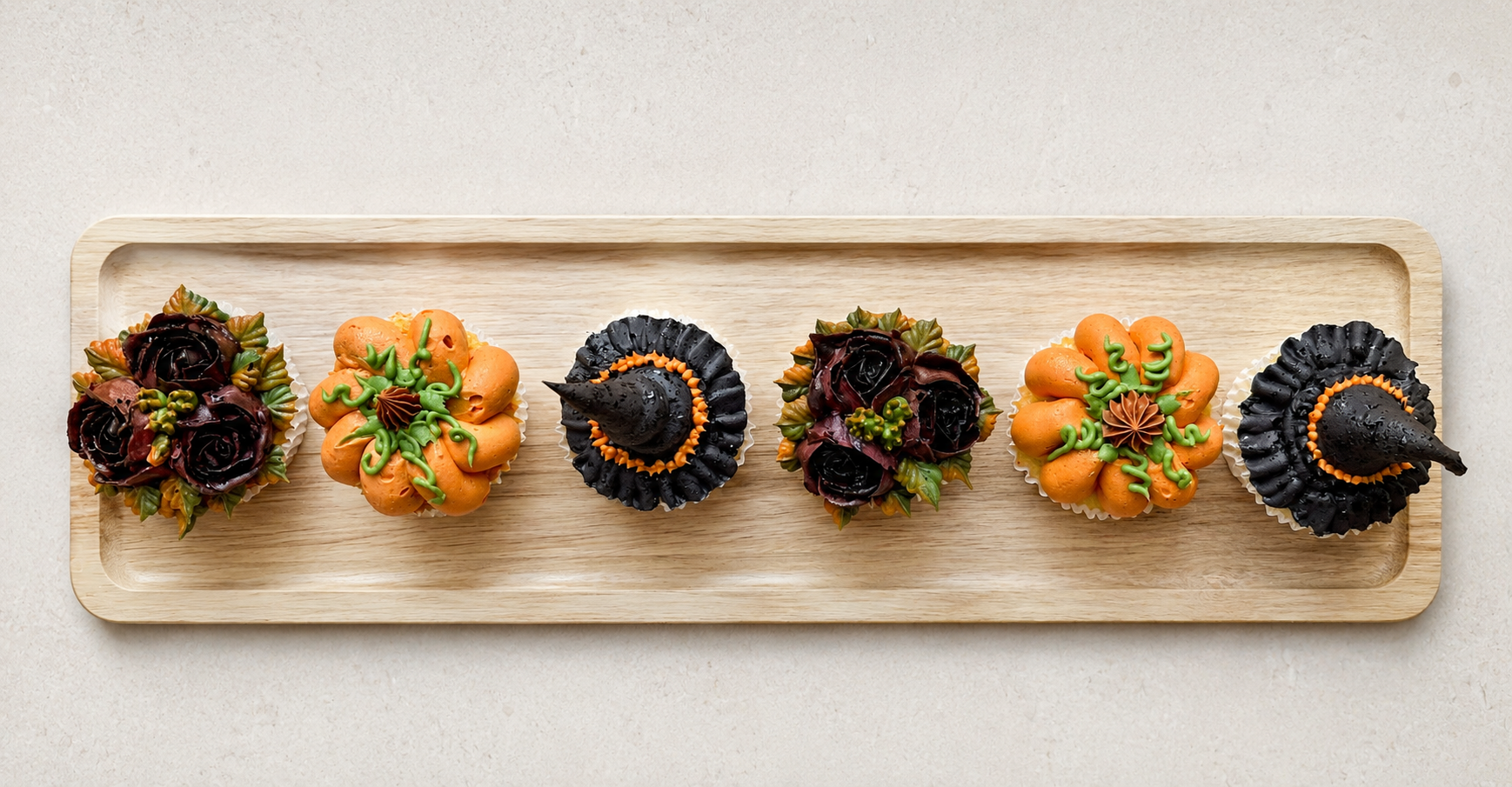 Hand-piped Halloween cupcakes featuring a realistic 3D pumpkin, witch’s hat and black buttercream roses, handcrafted in Dublin by Full Bloom Bakehouse. Perfect for Halloween parties, spooky celebrations, autumn gatherings and themed events. Luxury Ha