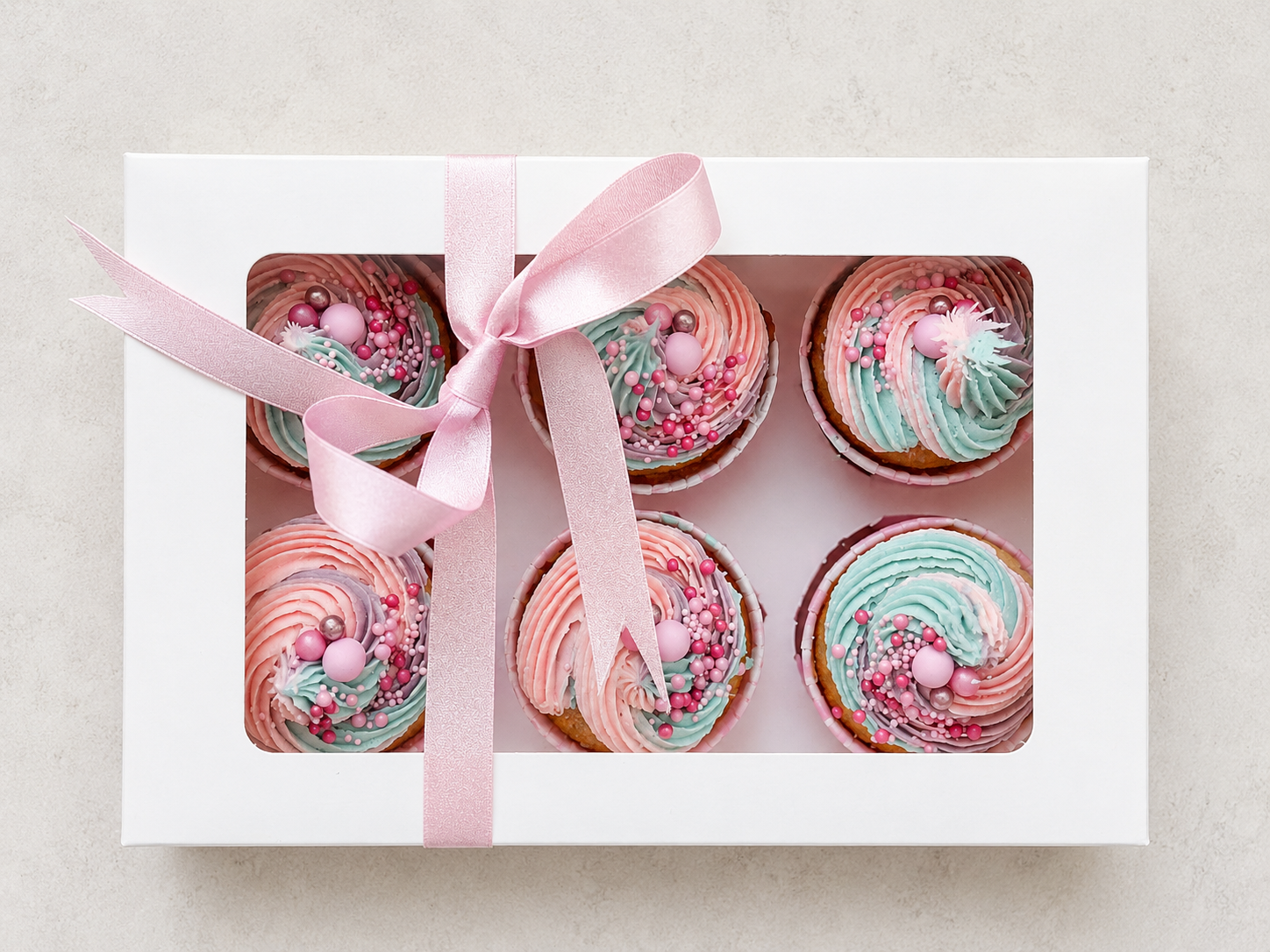 Pastel pink and blue swirl cupcakes, handcrafted in Dublin by Full Bloom Bakehouse. Perfect for kids' birthdays, unicorn-themed parties, gender reveal celebrations, baby showers and children's events. Luxury cupcakes decorated with elegant buttercrea