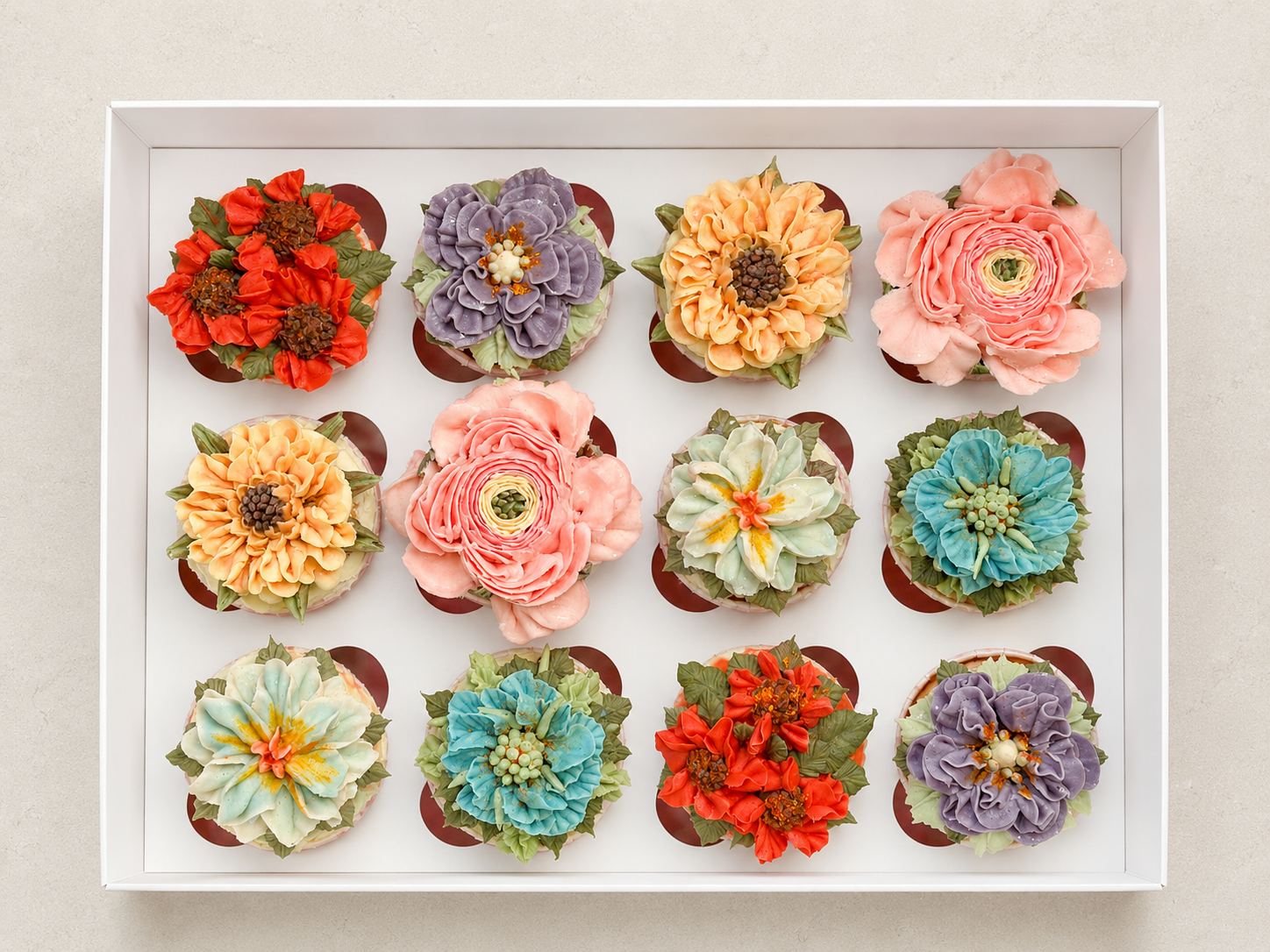 Hand-piped pastel floral cupcakes featuring pink roses and delicate buttercream flowers, handcrafted in Dublin by Full Bloom Bakehouse. Perfect for a baby girl celebration, girl's birthday party, spring gatherings and thoughtful summer gifts. Luxury 