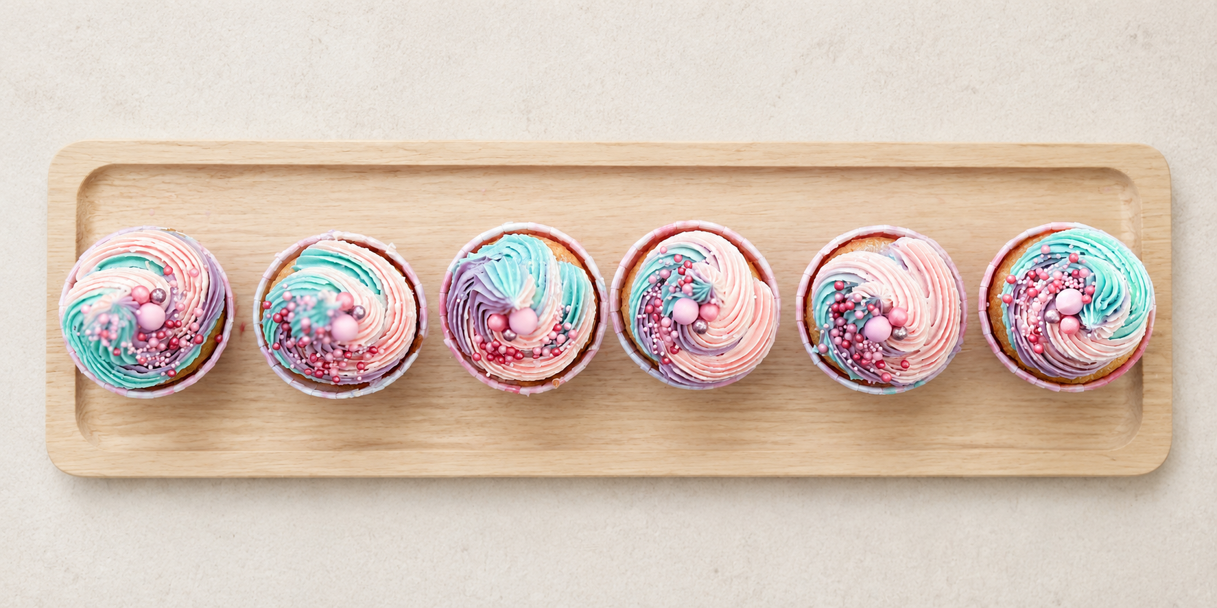 Pastel pink, blue and lilac swirl cupcakes, handcrafted in Dublin by Full Bloom Bakehouse. Perfect for unicorn parties, kids’ birthdays, girl’s birthday celebrations, gender reveal parties and baby showers. Luxury buttercream swirl cupcakes available