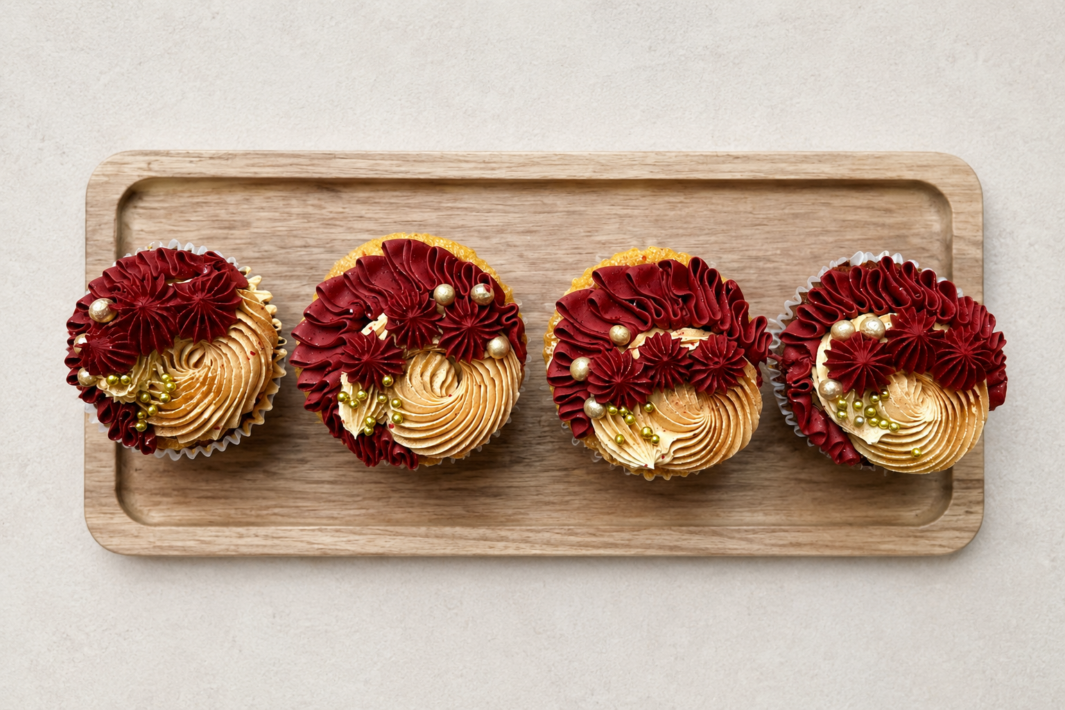 Vibrant burgundy and gold swirl cupcakes, handcrafted in Dublin by Full Bloom Bakehouse. Perfect for New Year’s Eve parties, milestone birthdays, corporate events, evening celebrations and special occasions. Luxury buttercream swirl cupcakes availabl