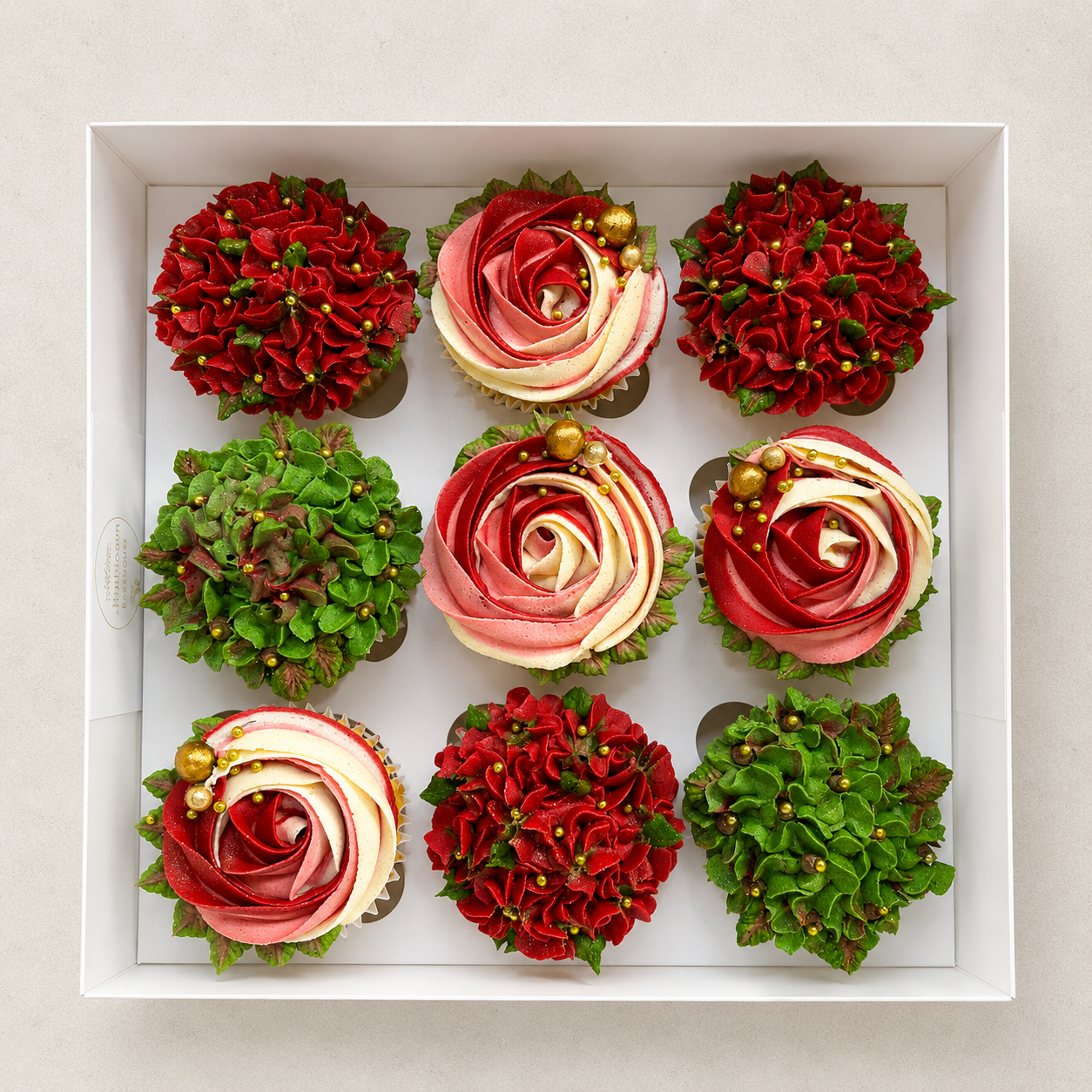 Hand-piped white and blush pink rosette cupcakes paired with green hydrangea-style buttercream flowers and finished with elegant gold sugar pearls. Handcrafted in Dublin by Full Bloom Bakehouse, these luxury floral cupcakes are perfect for birthdays,