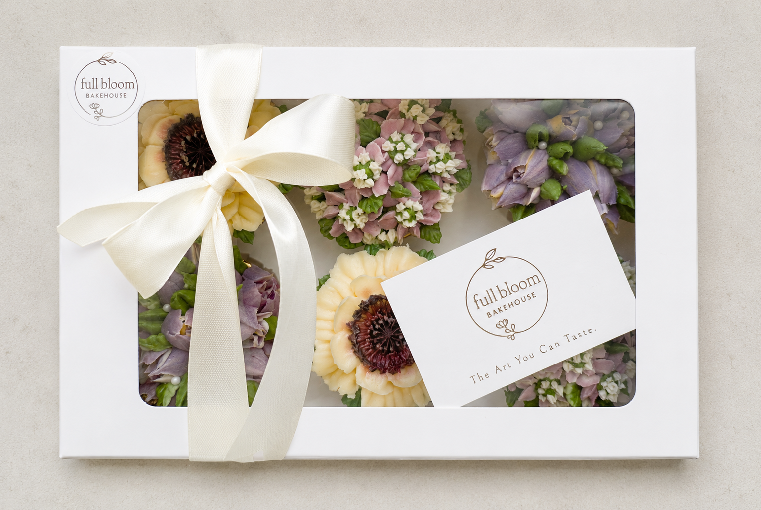 Hand-piped lilac tulip and white poppy cupcakes, handcrafted in Dublin by Full Bloom Bakehouse. Featuring elegant buttercream flowers in soft pastel tones, these luxury floral cupcakes are perfect for birthdays, spring celebrations, gifts and special