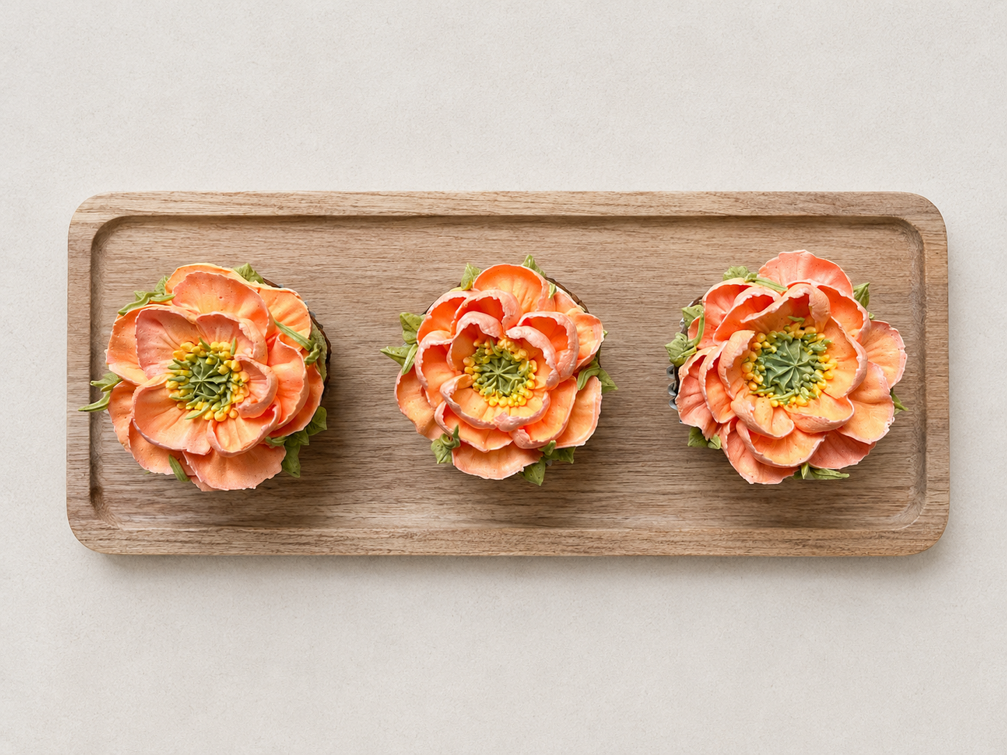 Hand-piped orange poppy cupcakes, handcrafted in Dublin by Full Bloom Bakehouse. Featuring realistic buttercream flowers inspired by vibrant spring and summer blooms, these luxury floral cupcakes are perfect for birthdays, gifts, celebrations and spe