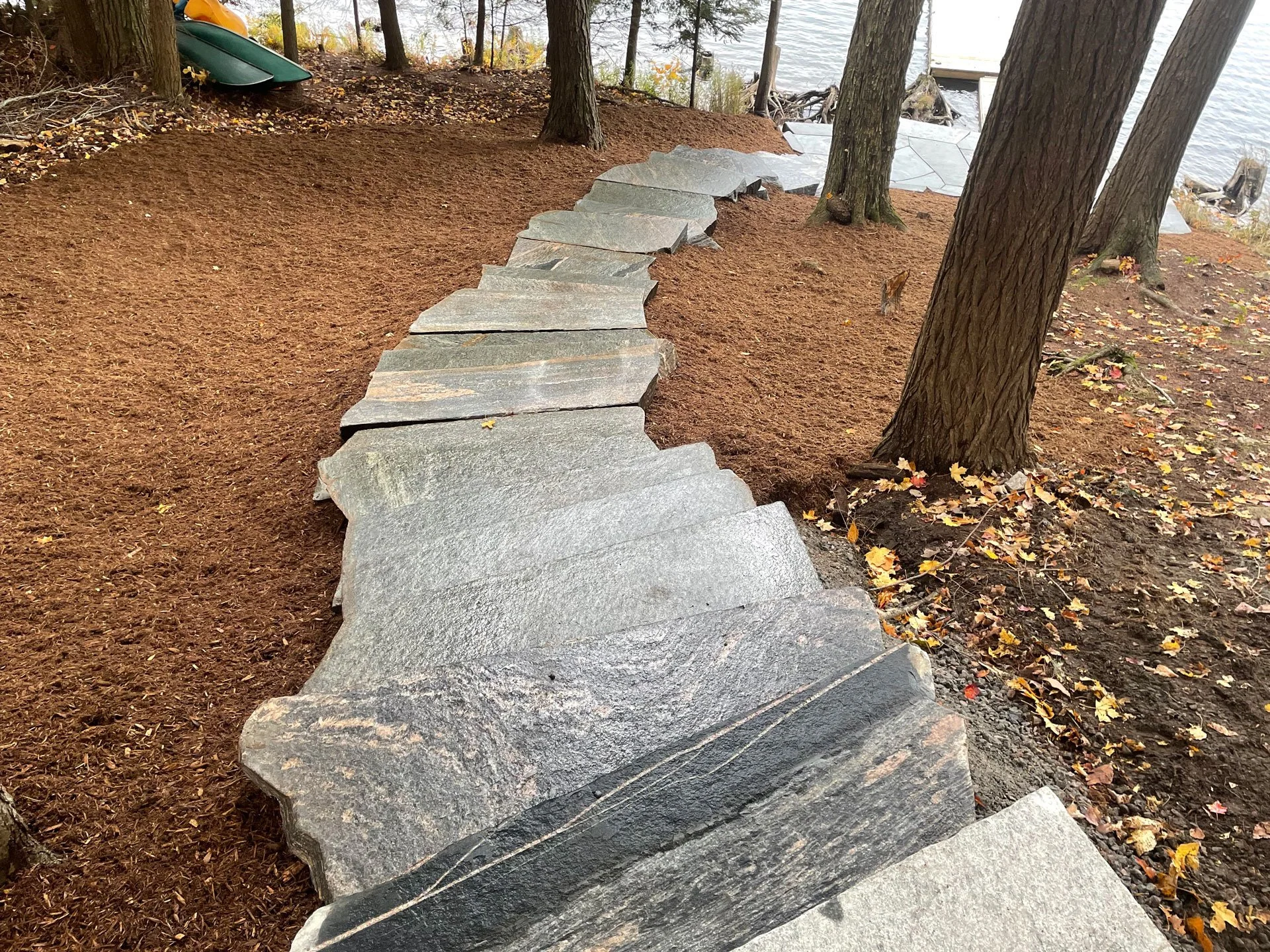 Granite steps down to a lake