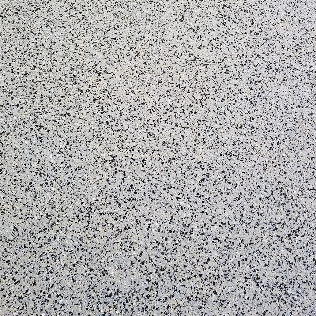 A speckled surface with black, white, and gray dots evenly distributed.