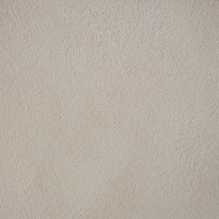 Close-up of a beige textured wall.