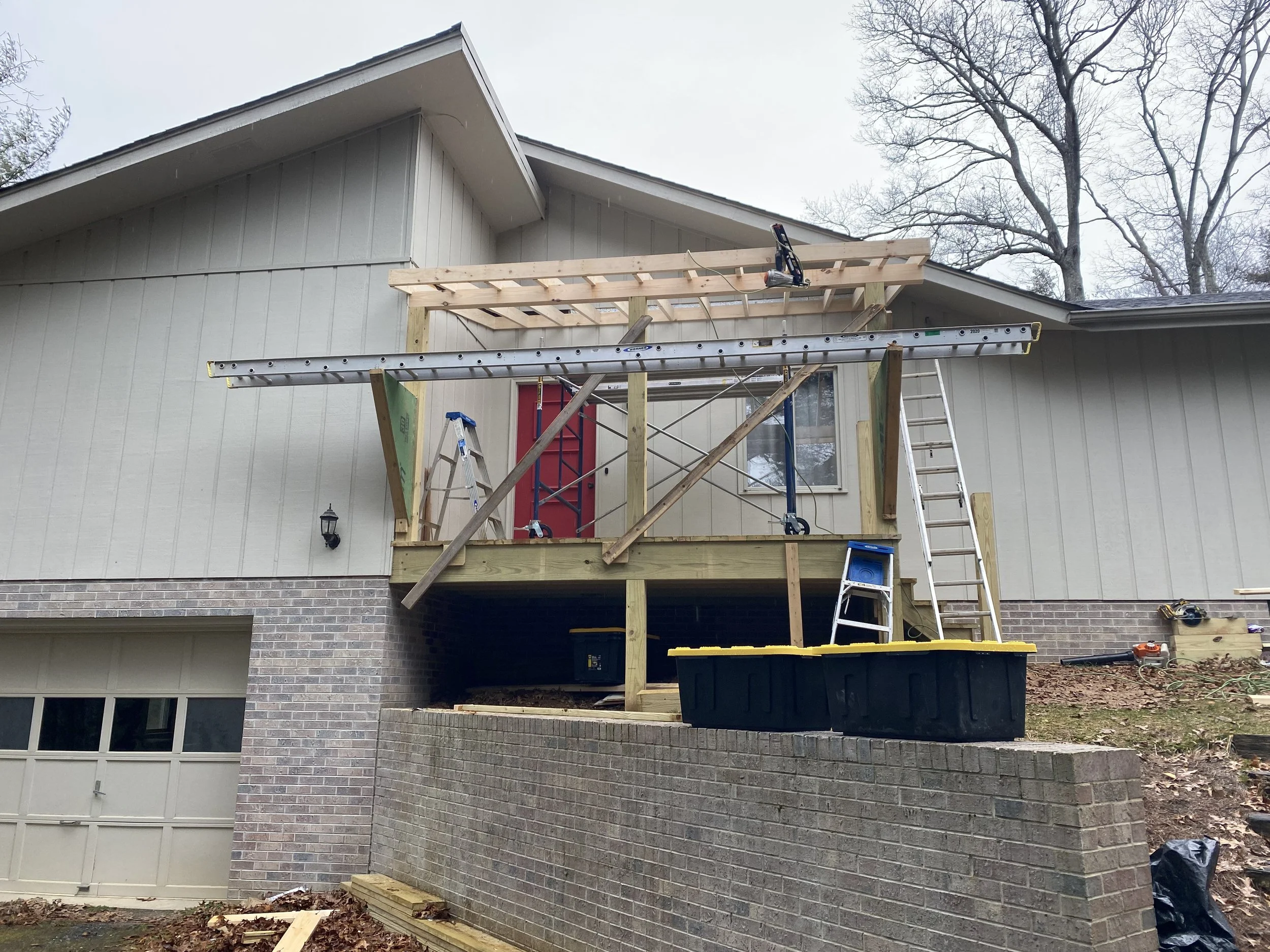 Construction of a new wooden deck or balcony on the back of a house, by Antonio’s Construction providing exterior construction in Ashe County and Watauga County, NC
