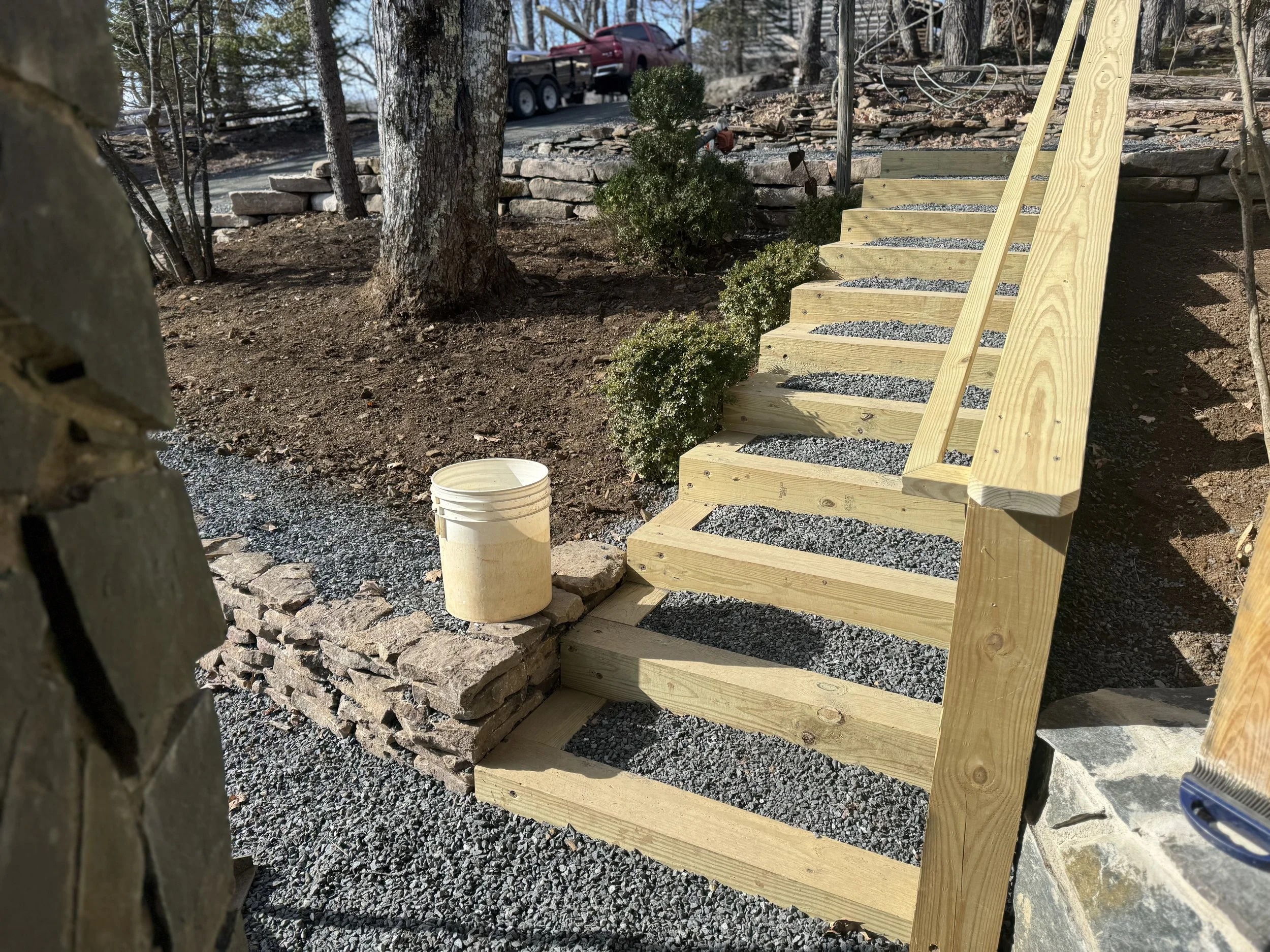 Wooden staircase under by Antonio’s Construction providing exterior construction in Ashe County and Watauga County, NC