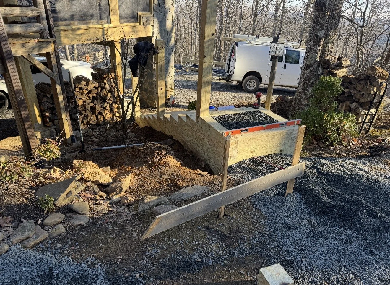 Construction site with wooden steps and railing by Antonio's Construction serving Ashe and Watauga County in North Carolina.