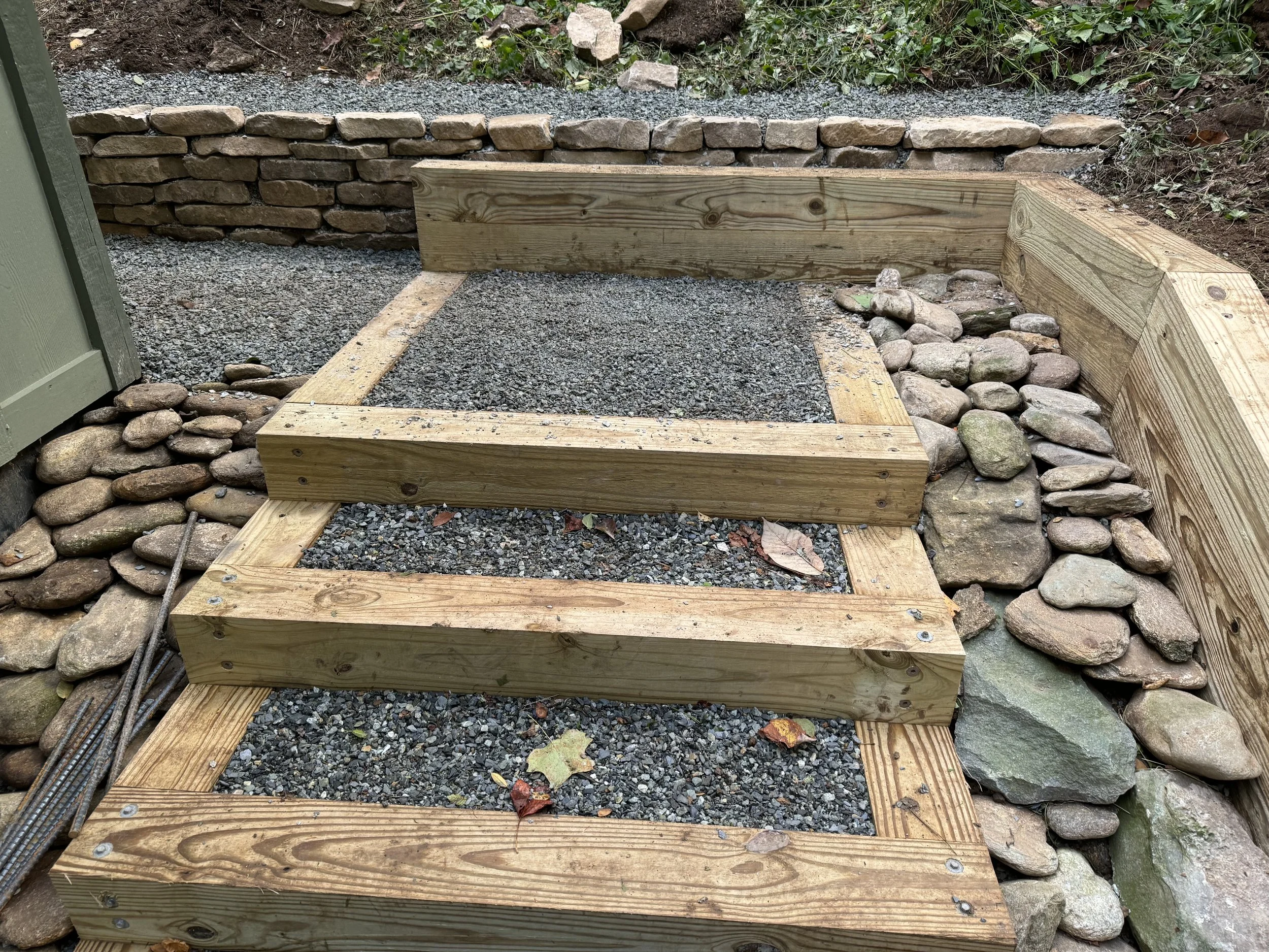 Wooden staircase with gravel steps by Antonio’s Construction providing exterior construction in Ashe County and Watauga County, NC