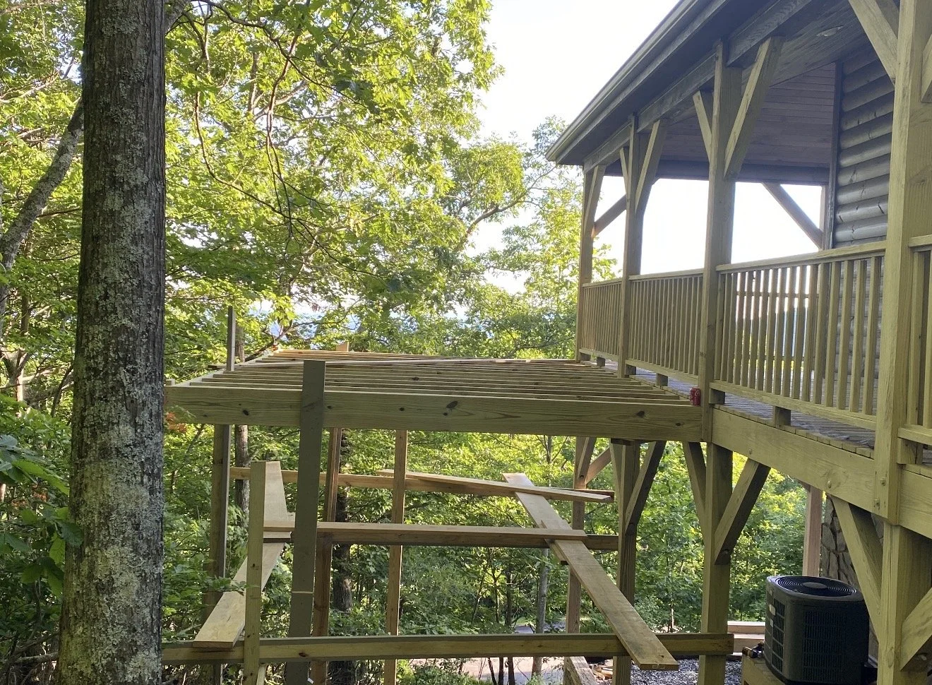 Wooden porch under construction  by Antonio's Construction serving Ashe and Watauga County in North Carolina.