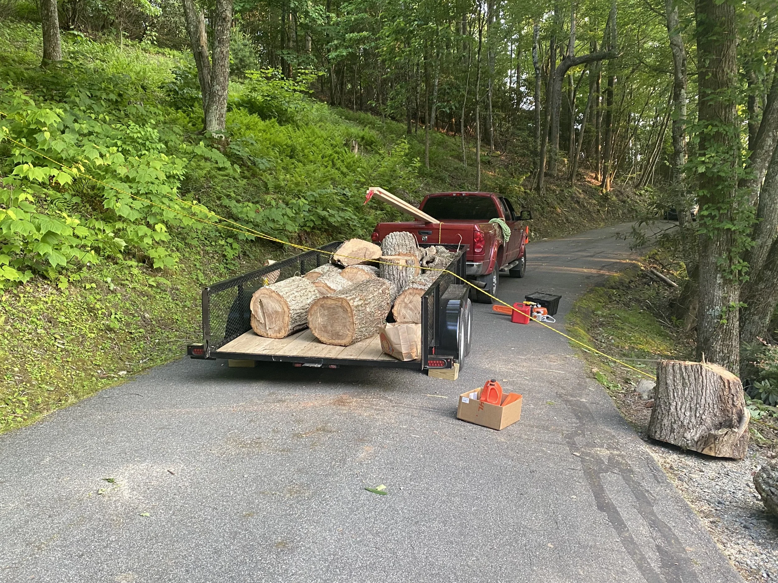 A trailer loaded with cut logs Antonio’s Construction providing exterior construction in Ashe County and Watauga County, NC