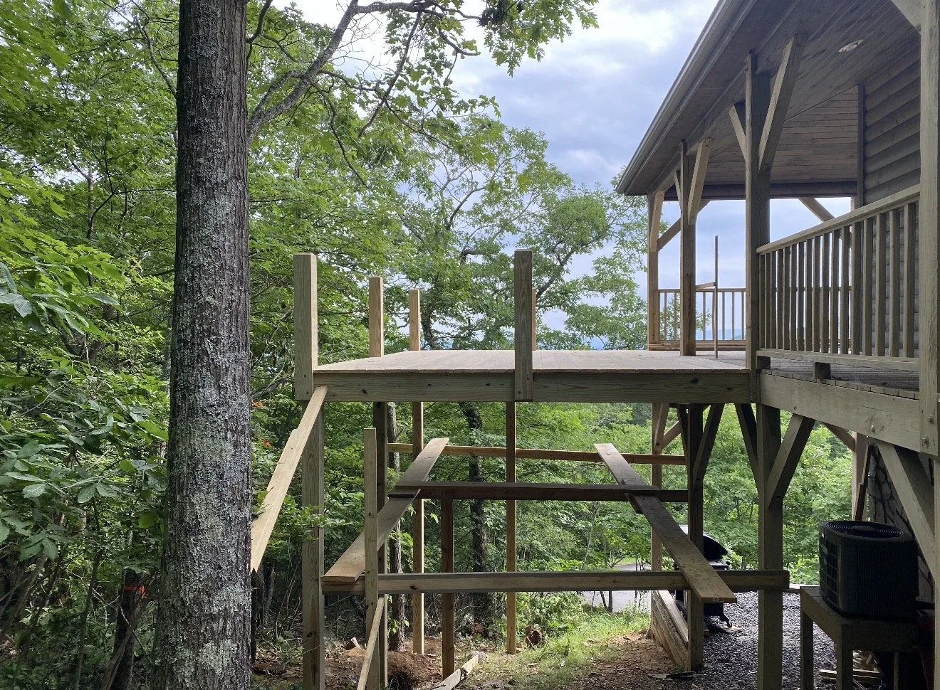 Unfinished wooden deck under construction by Antonio's Construction serving Ashe and Watauga County in North Carolina.