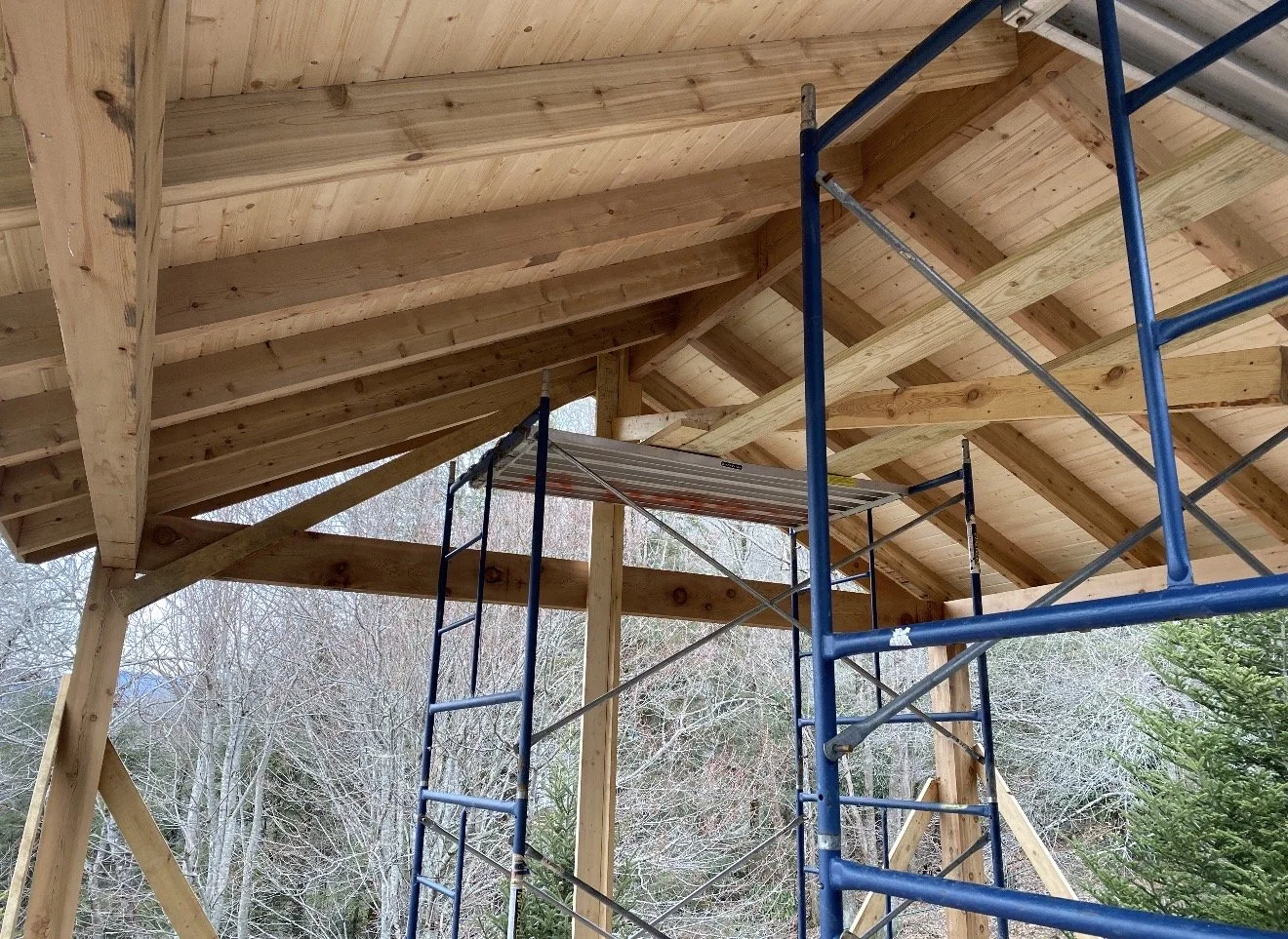 Wooden structure being built with scaffolding by Antonio's Construction serving Ashe and Watauga County in North Carolina.