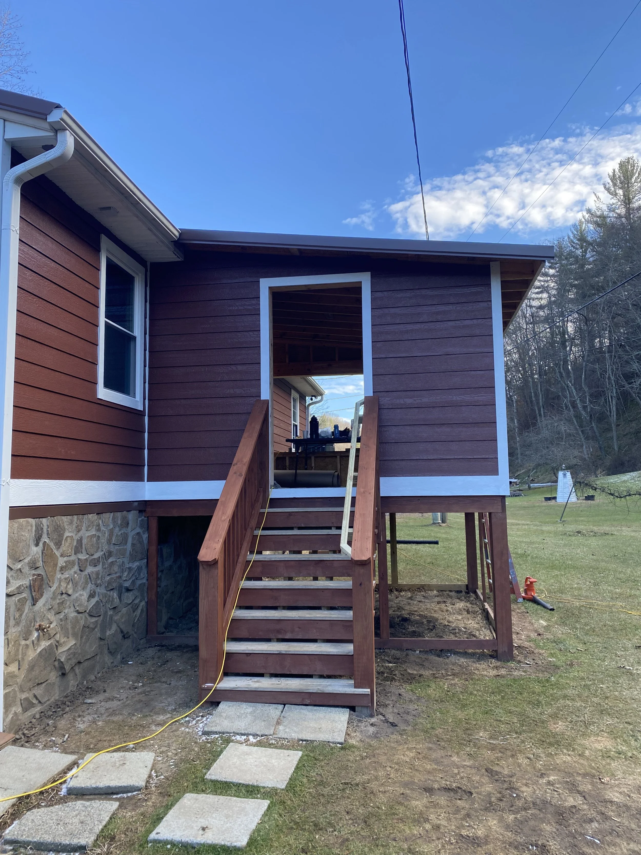 Construction of a wooden staircase by Antonio’s Construction providing exterior construction in Ashe County and Watauga County, NC