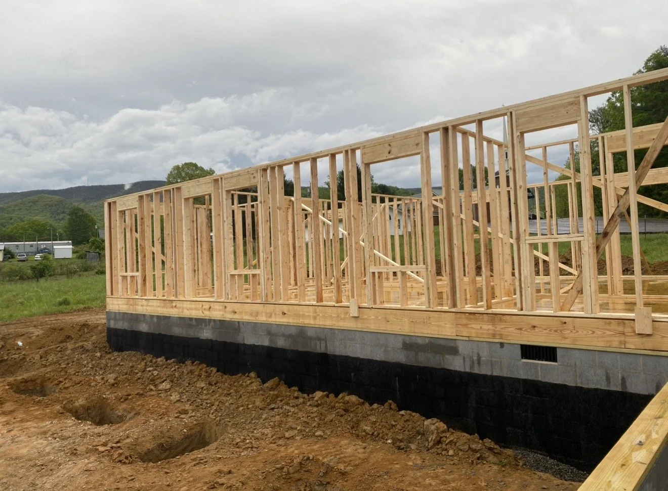 Wooden frame of a house under construction Antonio's Construction serving Ashe and Watauga County in North Carolina.