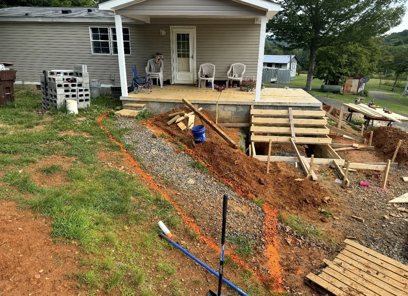 Construction site of a new staircase leading to a house porch by Antonio's Construction serving Ashe and Watauga County in North Carolina.