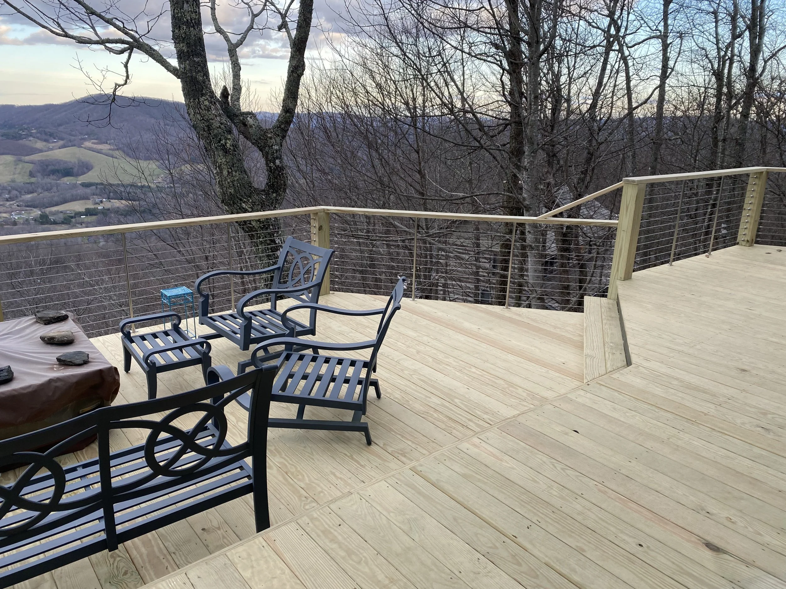 A spacious wooden deck built by Antonio’s Construction providing exterior construction in Ashe County and Watauga County, NC