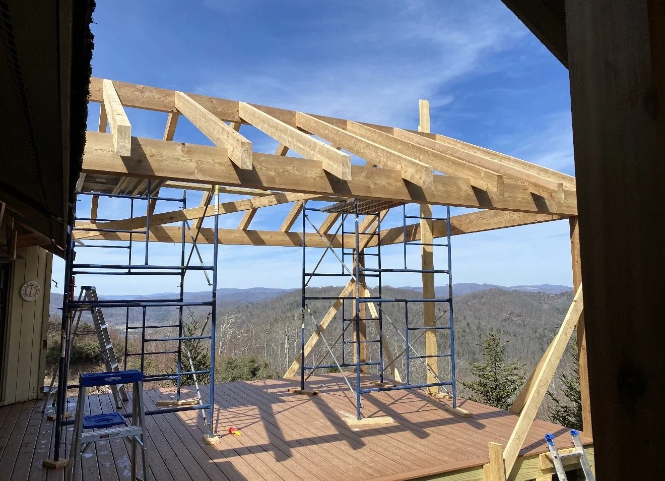 Construction site with wooden framework and scaffolding, Antonio's Construction serving Ashe and Watauga County in North Carolina.
