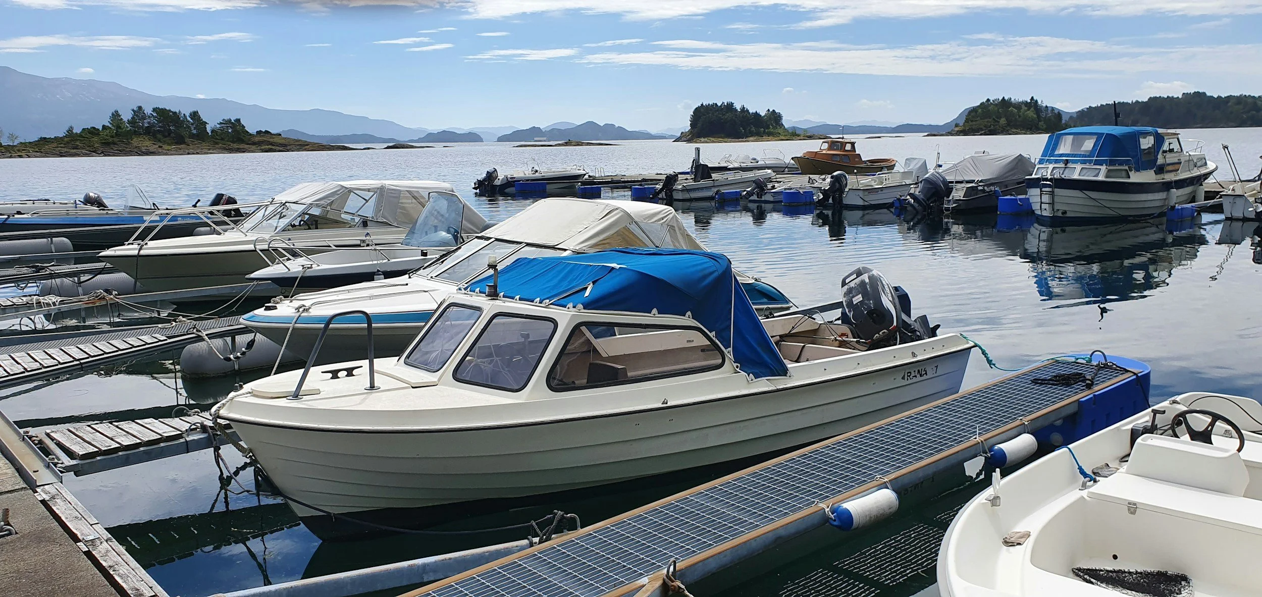 Image Alt Text: Boats docked at a marina – Marine Services businesses in the Les Cheneaux Islands