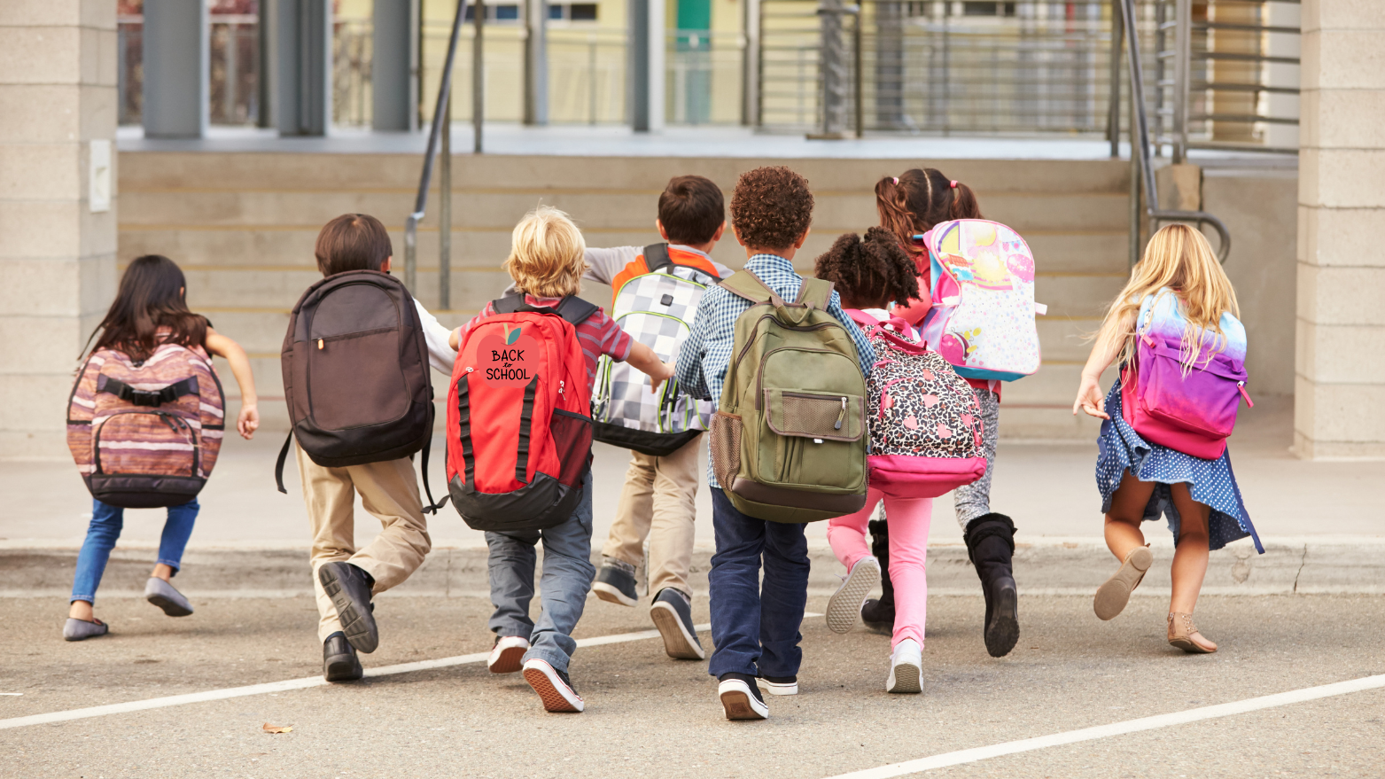 Kids with backpacks entering school – Community Organizations & Schools in the Les Cheneaux Islands