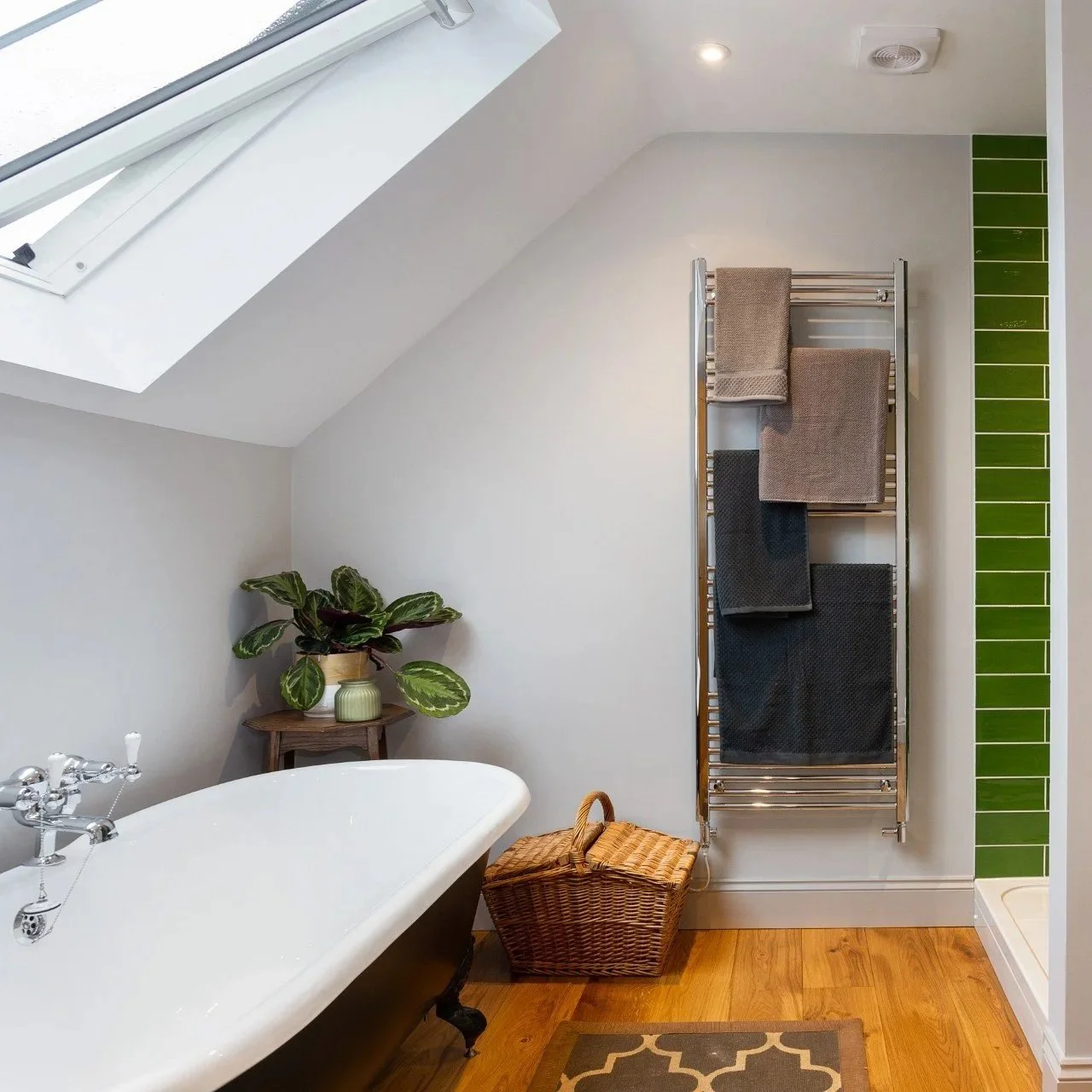 Bathroom with shower and roll top bath