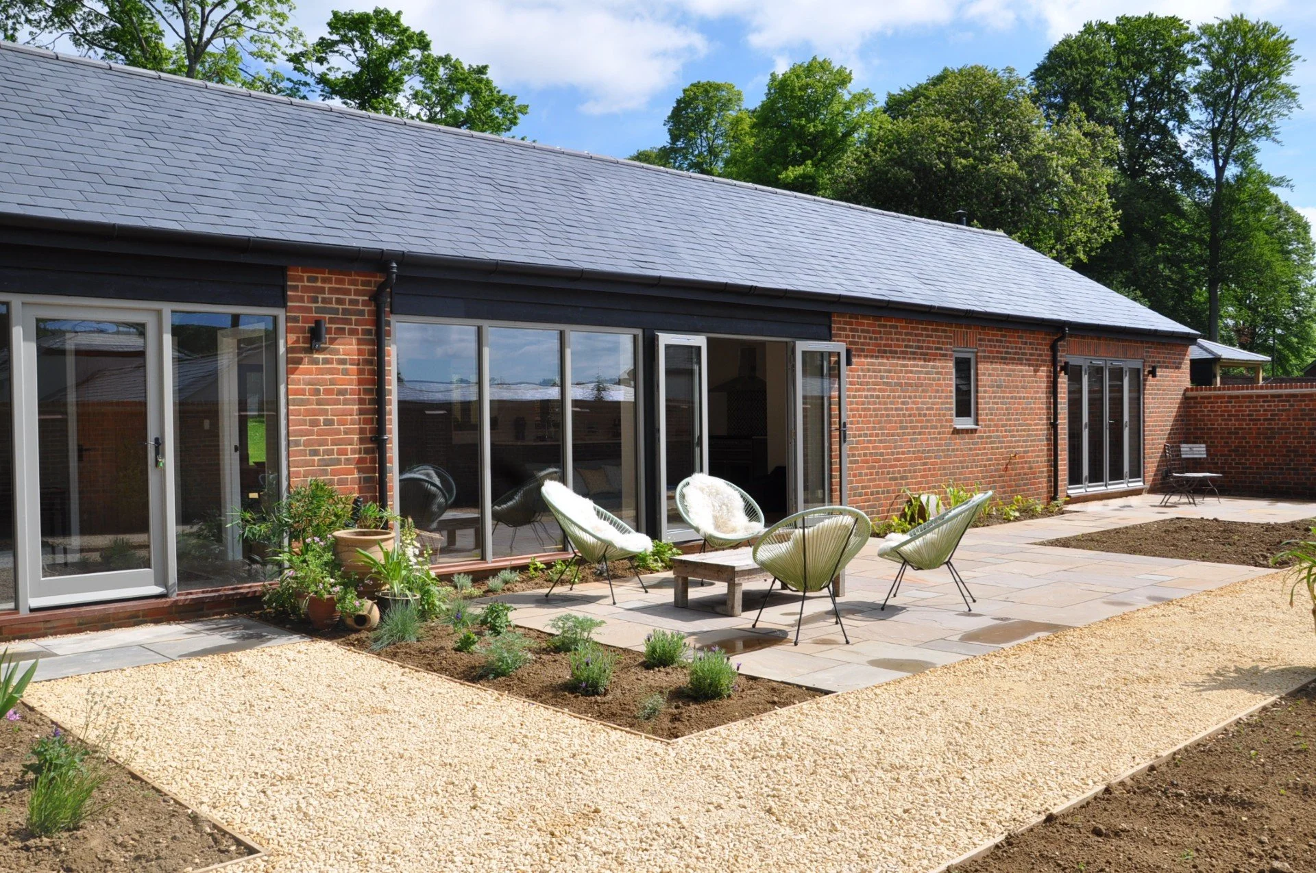 Exterior of barn conversion and courtyard garden