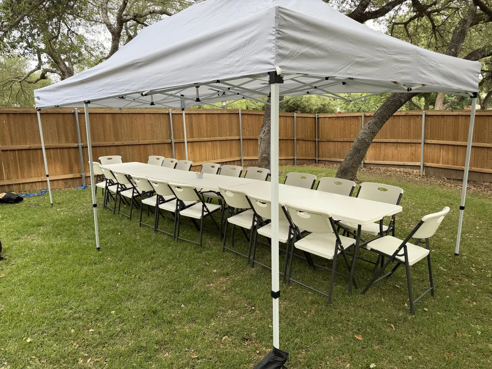 HCCR tent, tables and chairs set up for a backyard party