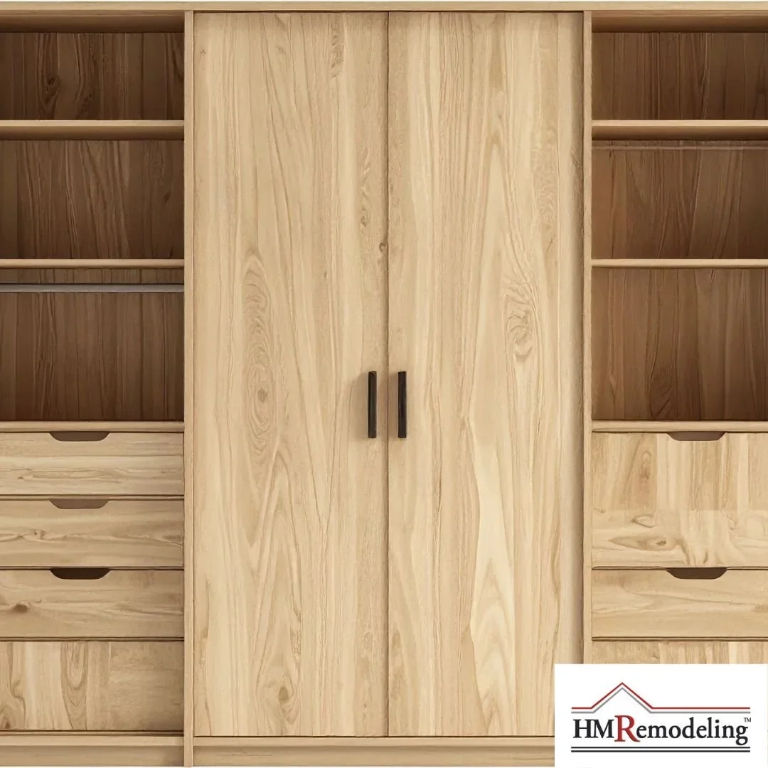 Custom built-in closet storage installation with natural wood wardrobe cabinet, open shelving, hanging rods, and built-in drawers by HM Remodeling in South Bend, Indiana