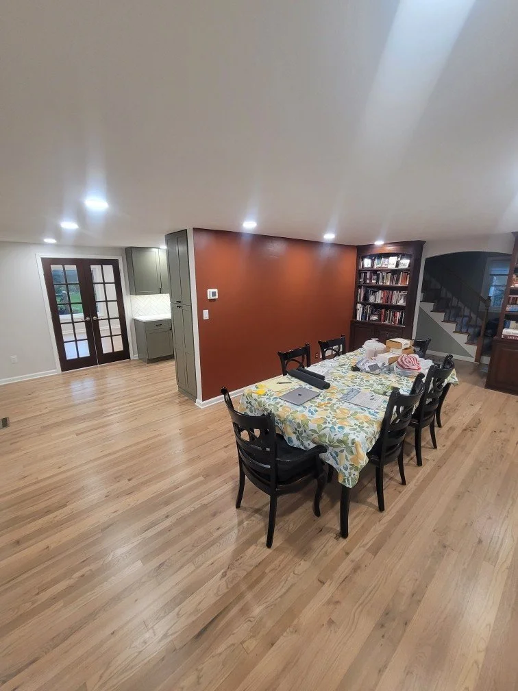 HM Remodeling open living room renovation with barn doors wood accent wall and recessed lighting in South Bend Indiana