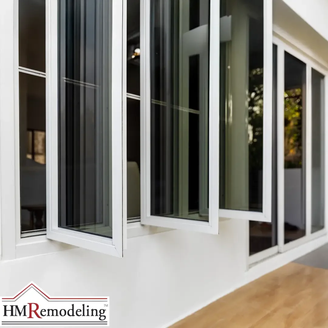 A row of white-framed casement windows cranked open along an exterior wall of a Michiana area home.